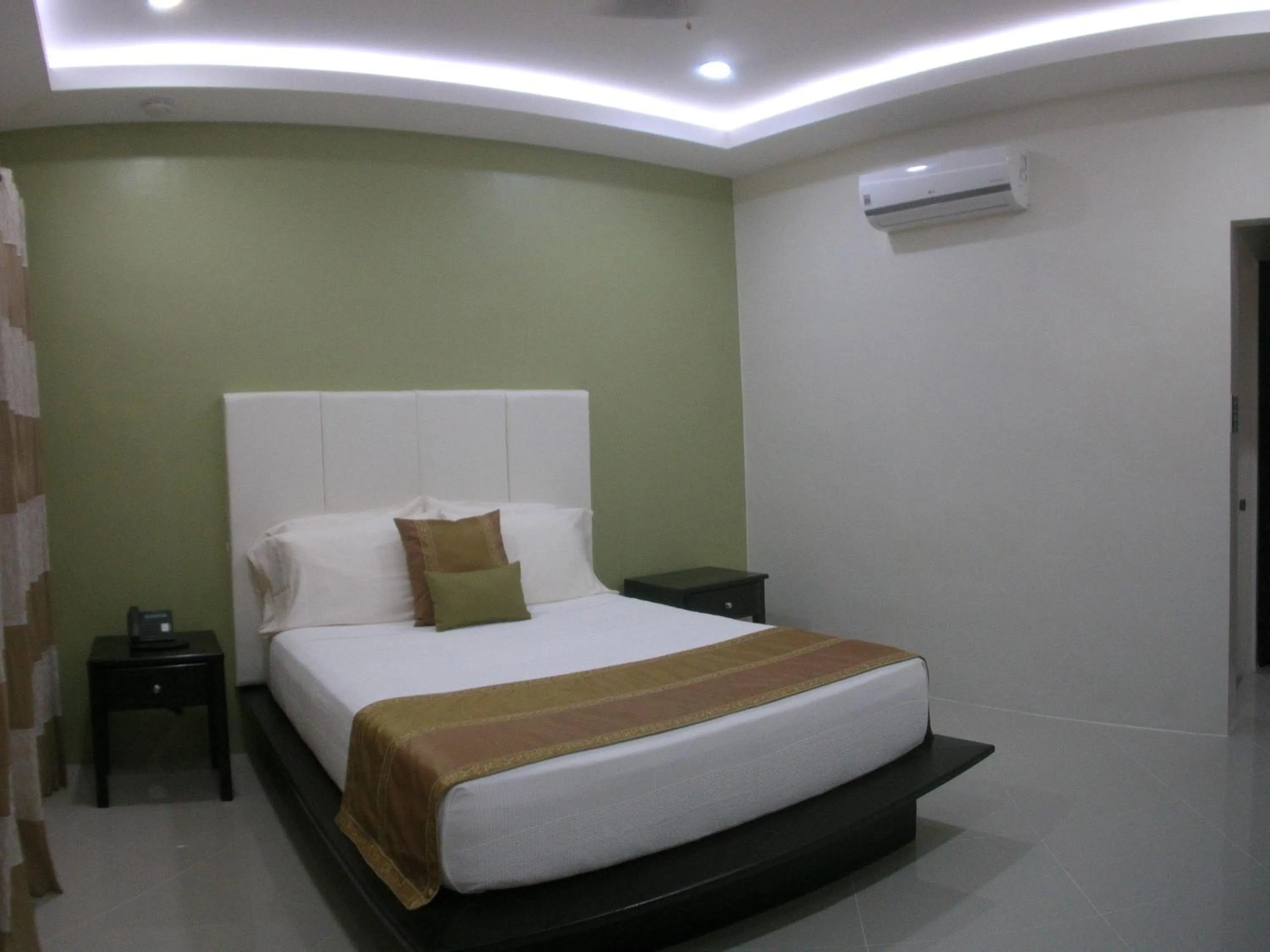 Bed in AJ's Place Beach Resort