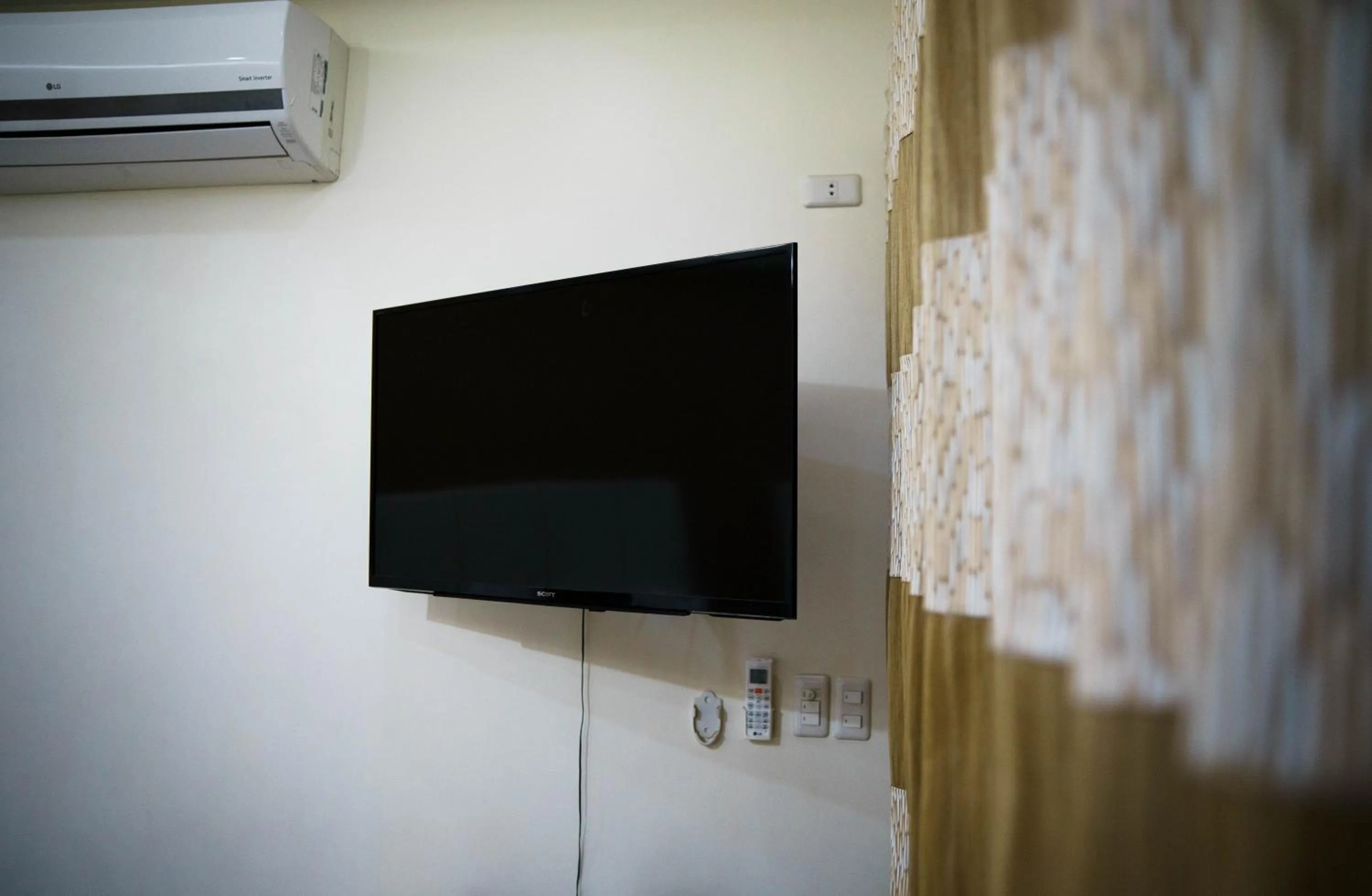 TV and multimedia in AJ's Place Beach Resort