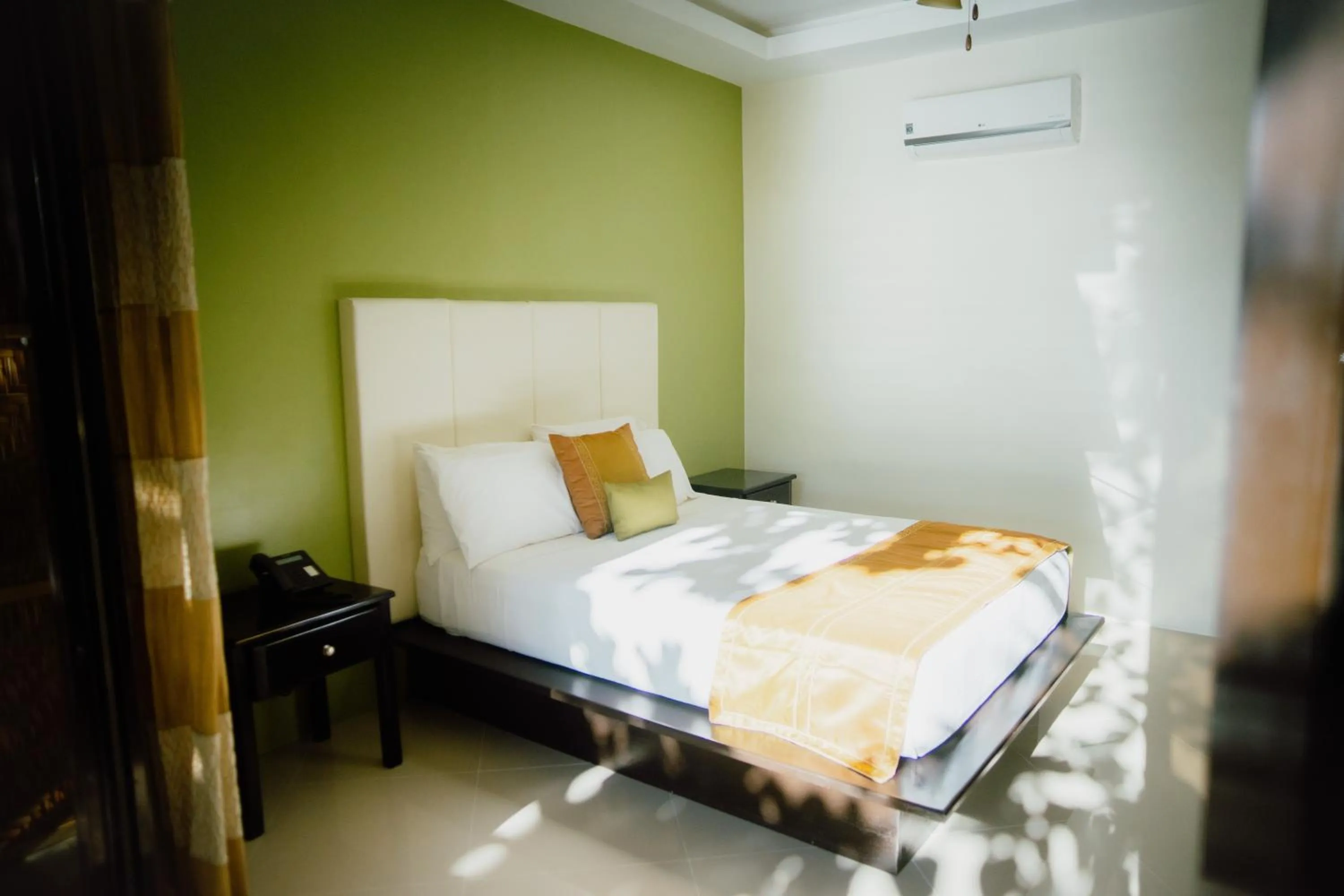 Bed in AJ's Place Beach Resort