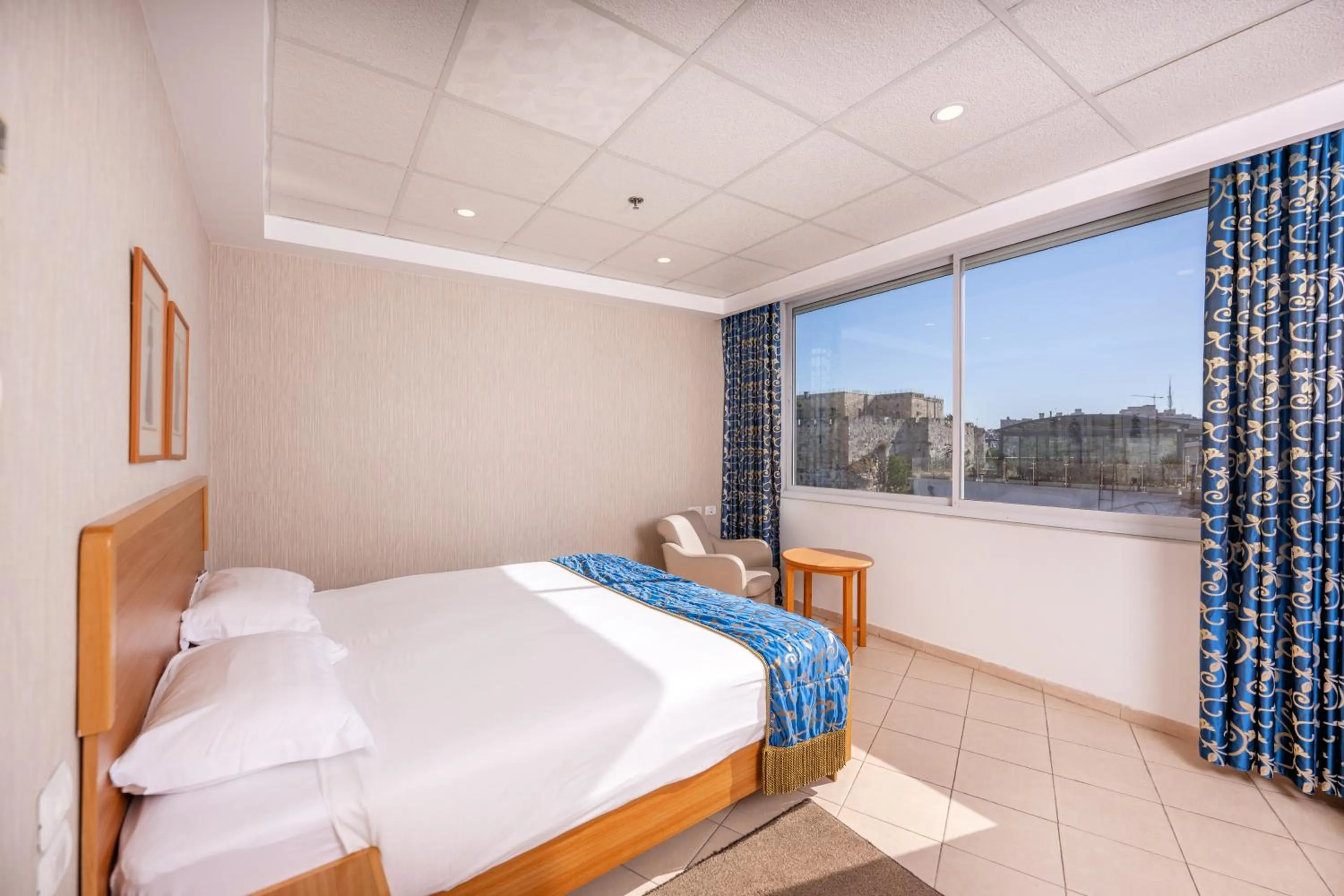 Bed in Golden Walls Hotel