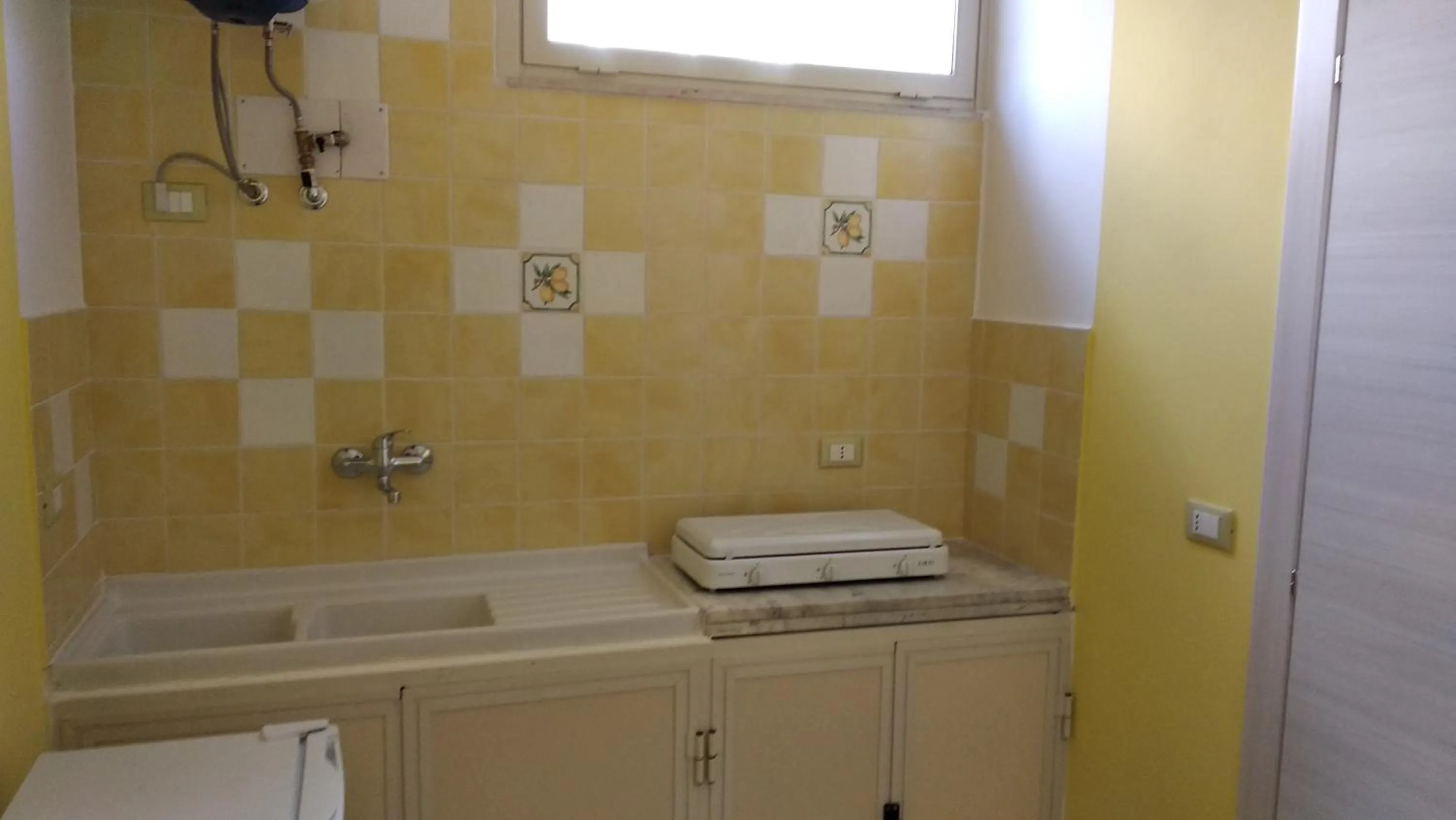 Kitchen or kitchenette in B&B Rossini