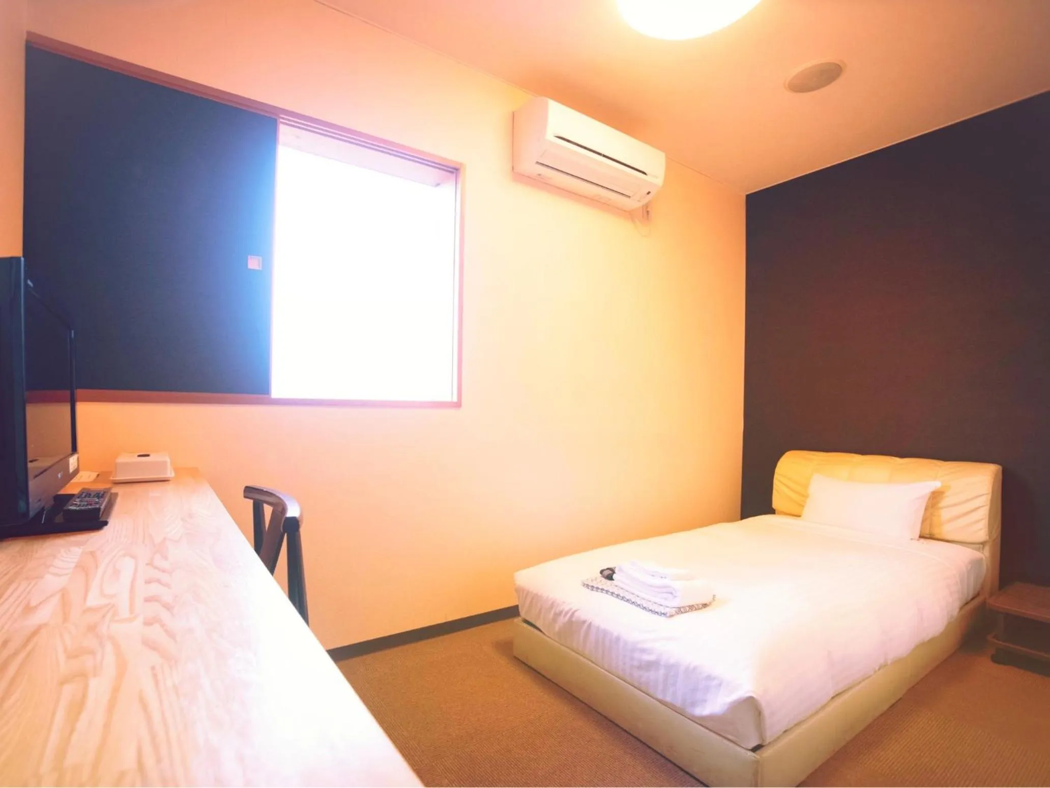 Bed in Hakodate Yunokawa Hotel Amamiyakan