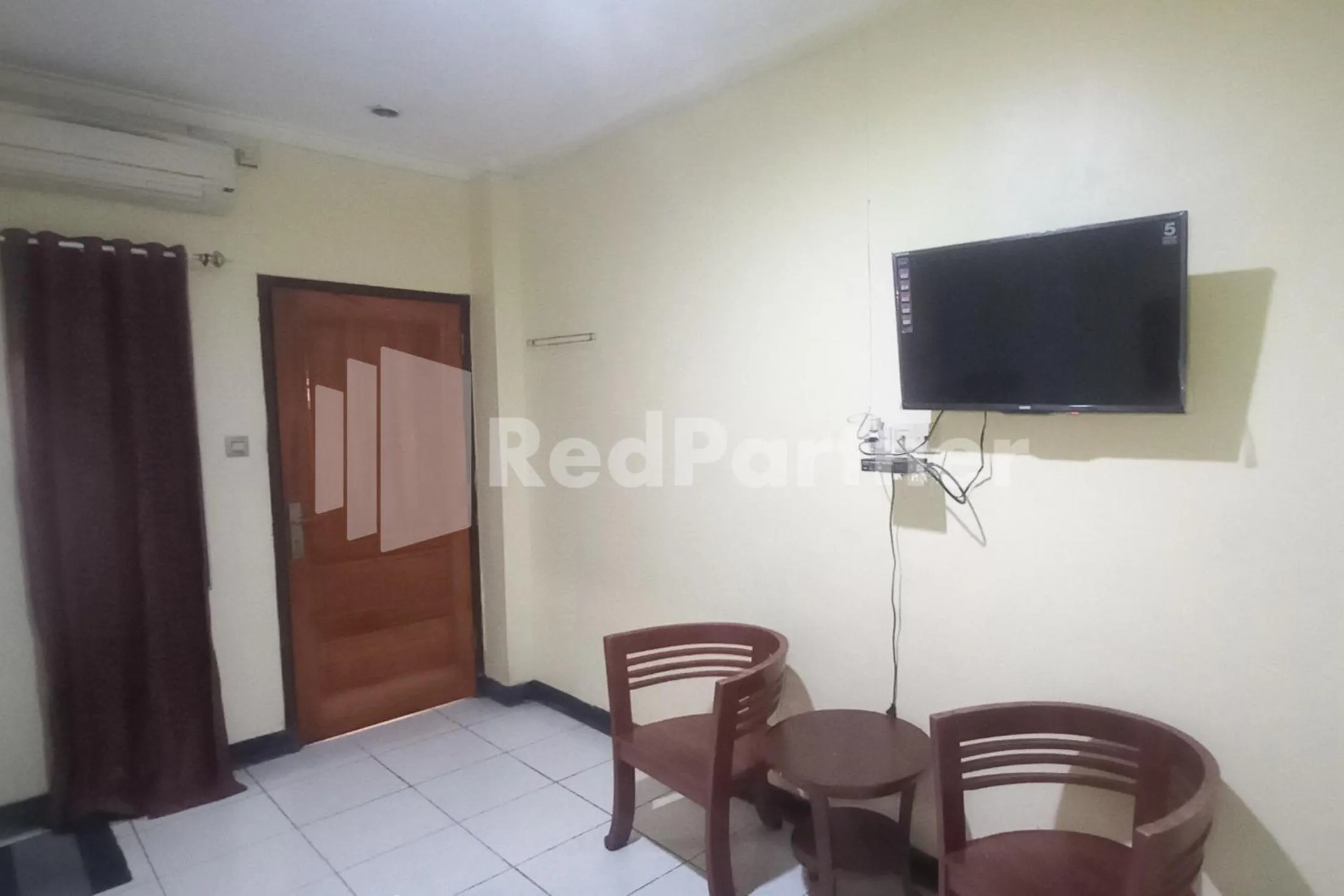 Bedroom in Hotel Palem 2 Syariah Malang Redpartner