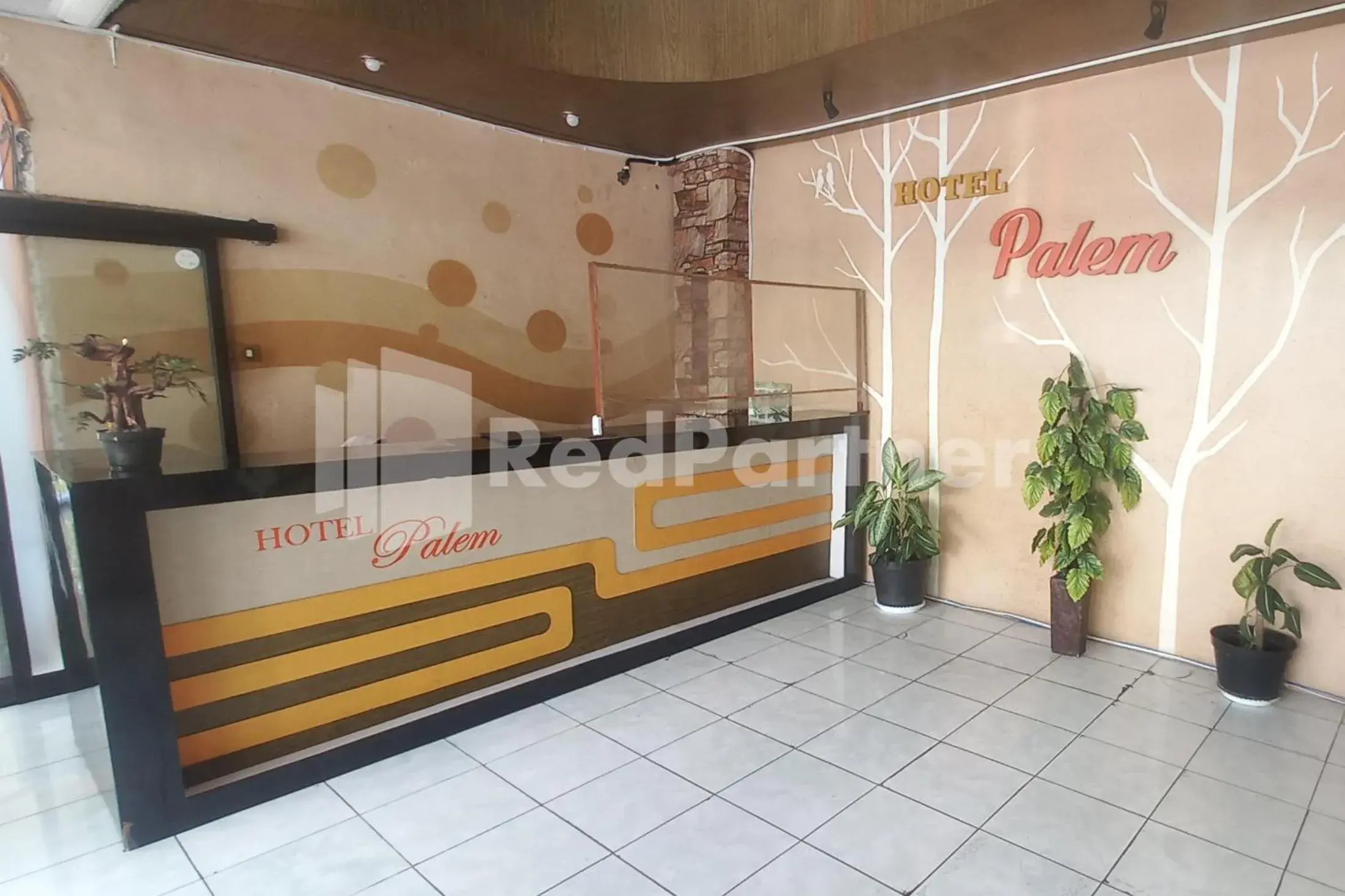 Lobby or reception in Hotel Palem 2 Syariah Malang Redpartner Lobby or reception in Hotel Palem 2 Syariah Malang Redpartner