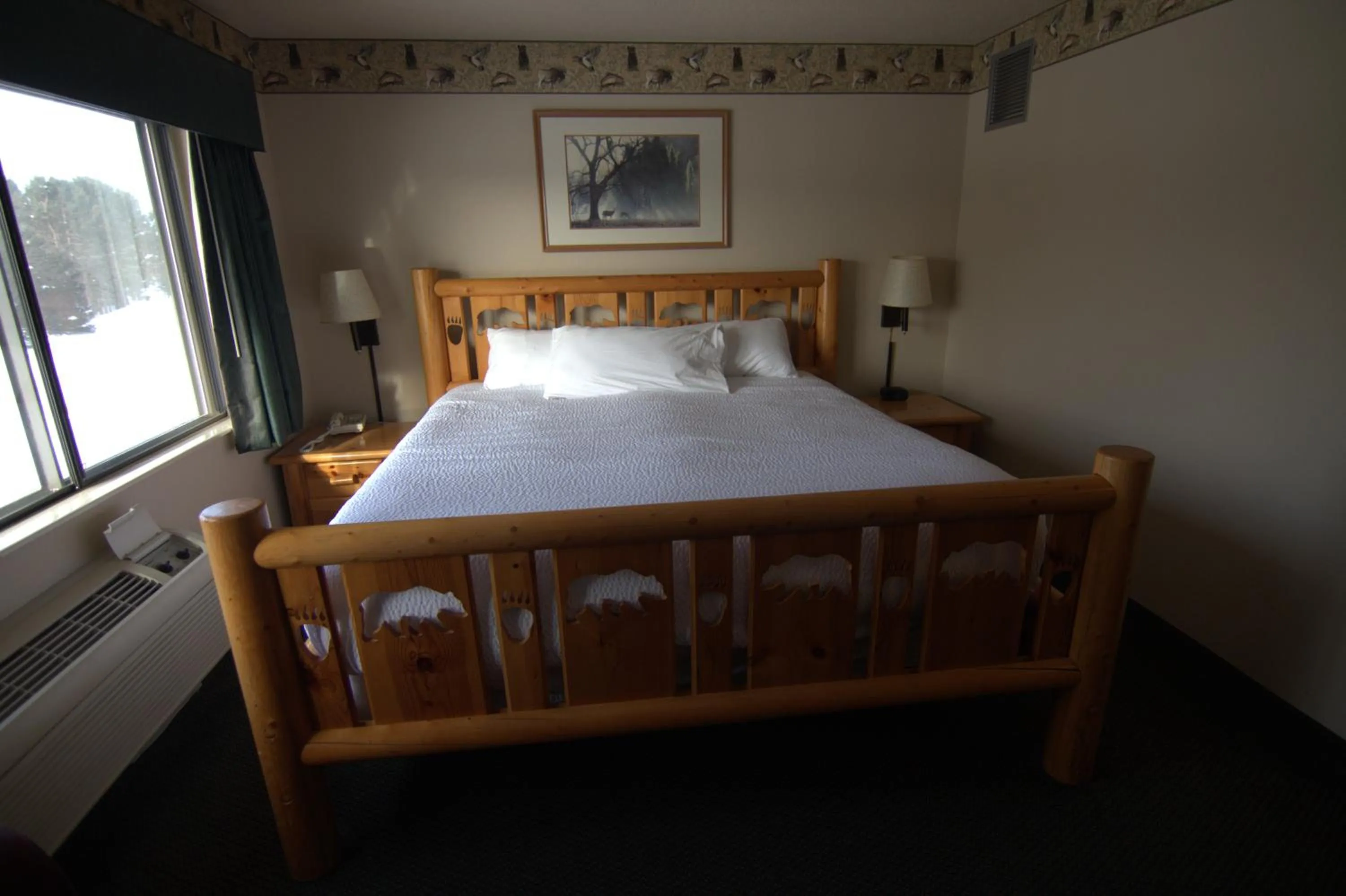 Bed in Shell Lake Lodge, a Travelodge by Wyndham