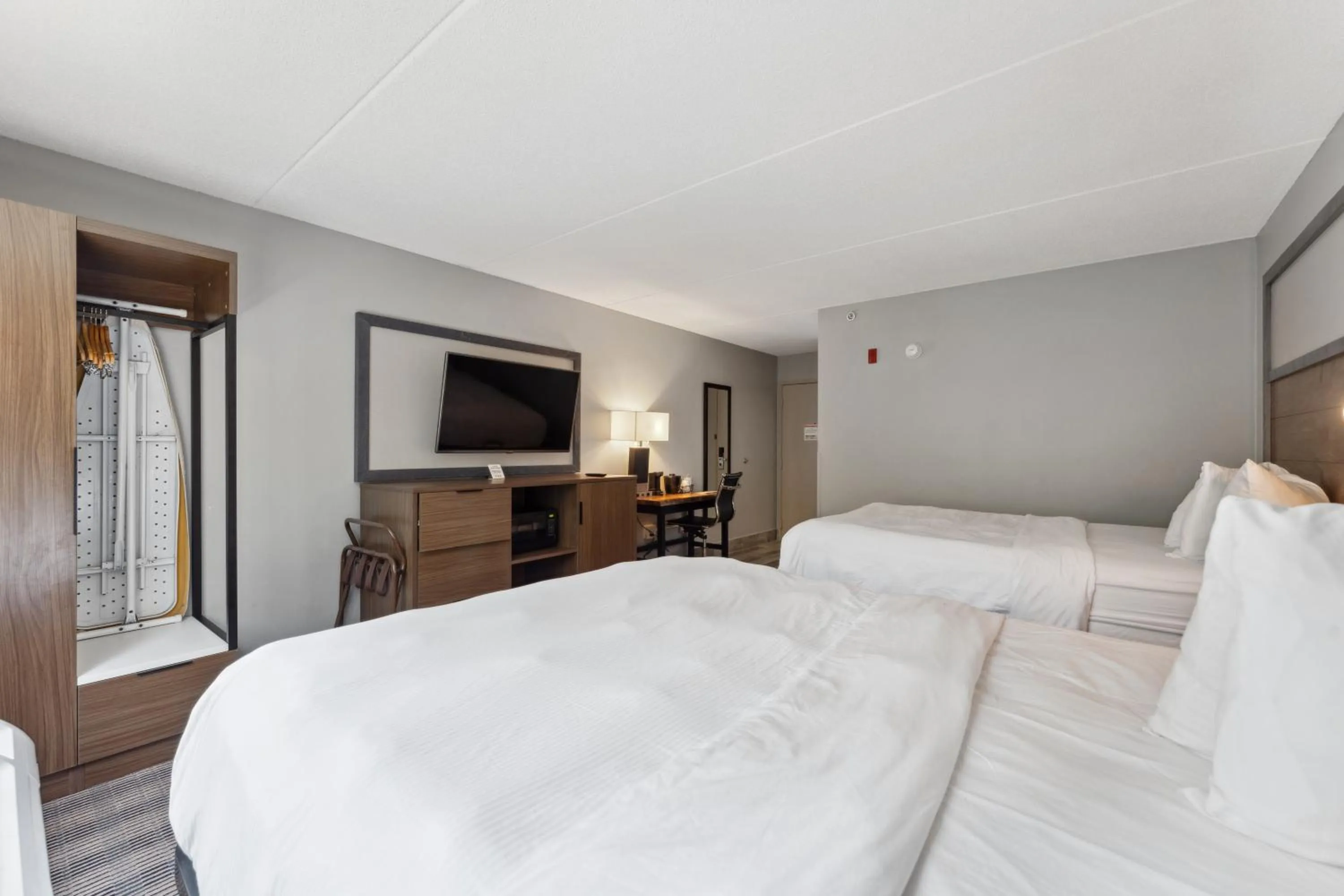 Bed in AmericInn by Wyndham Wisconsin Dells