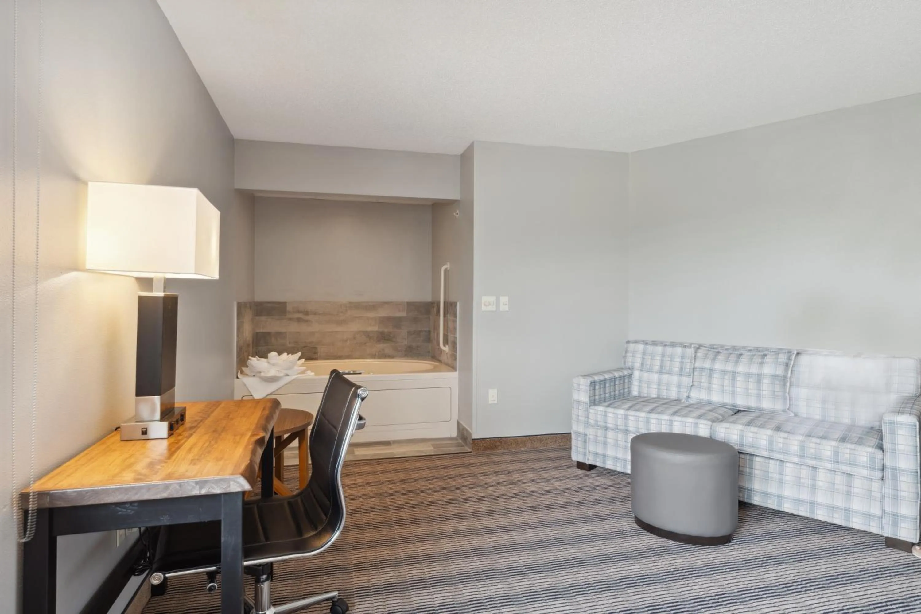 Bed in AmericInn by Wyndham Wisconsin Dells