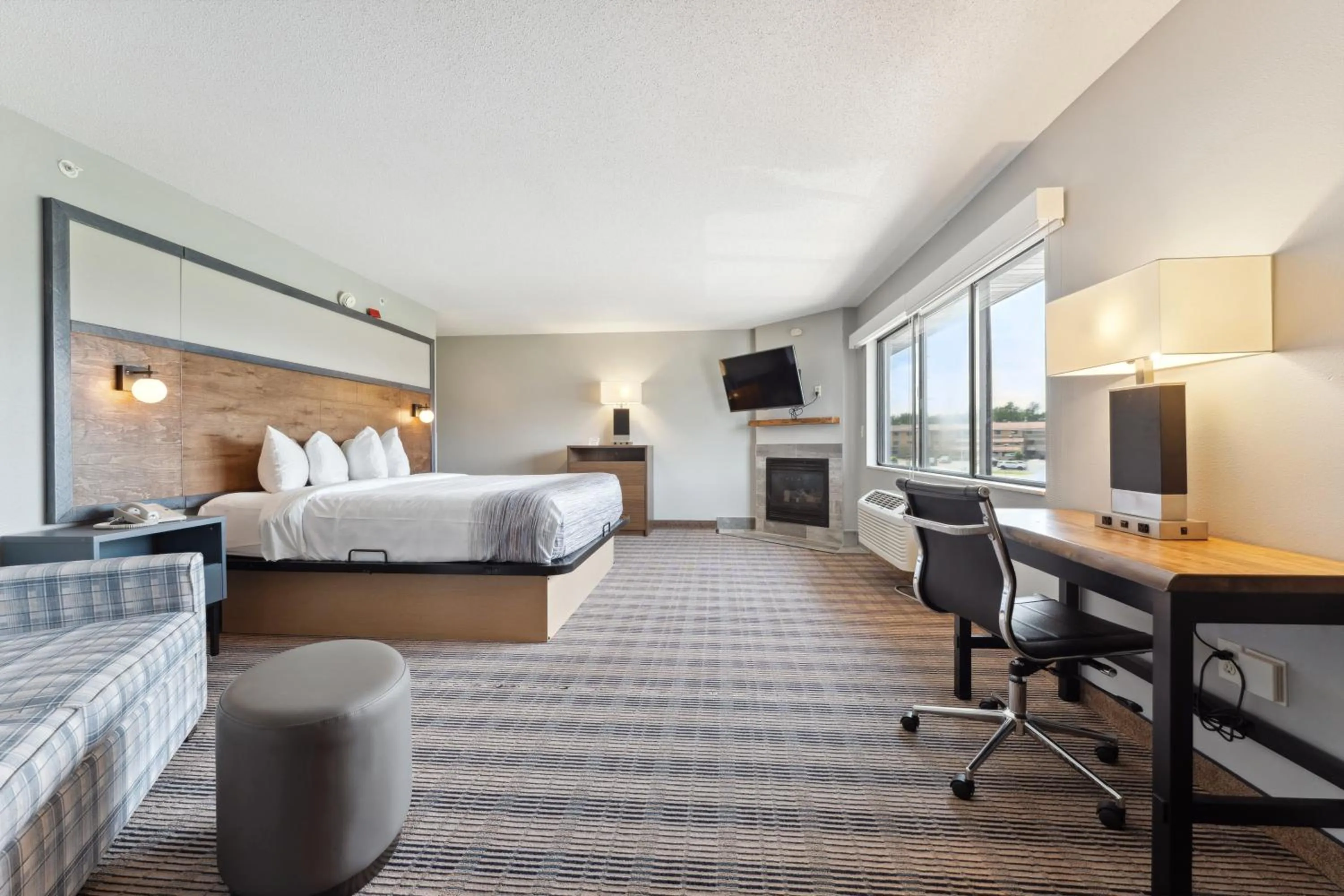 Bed in AmericInn by Wyndham Wisconsin Dells