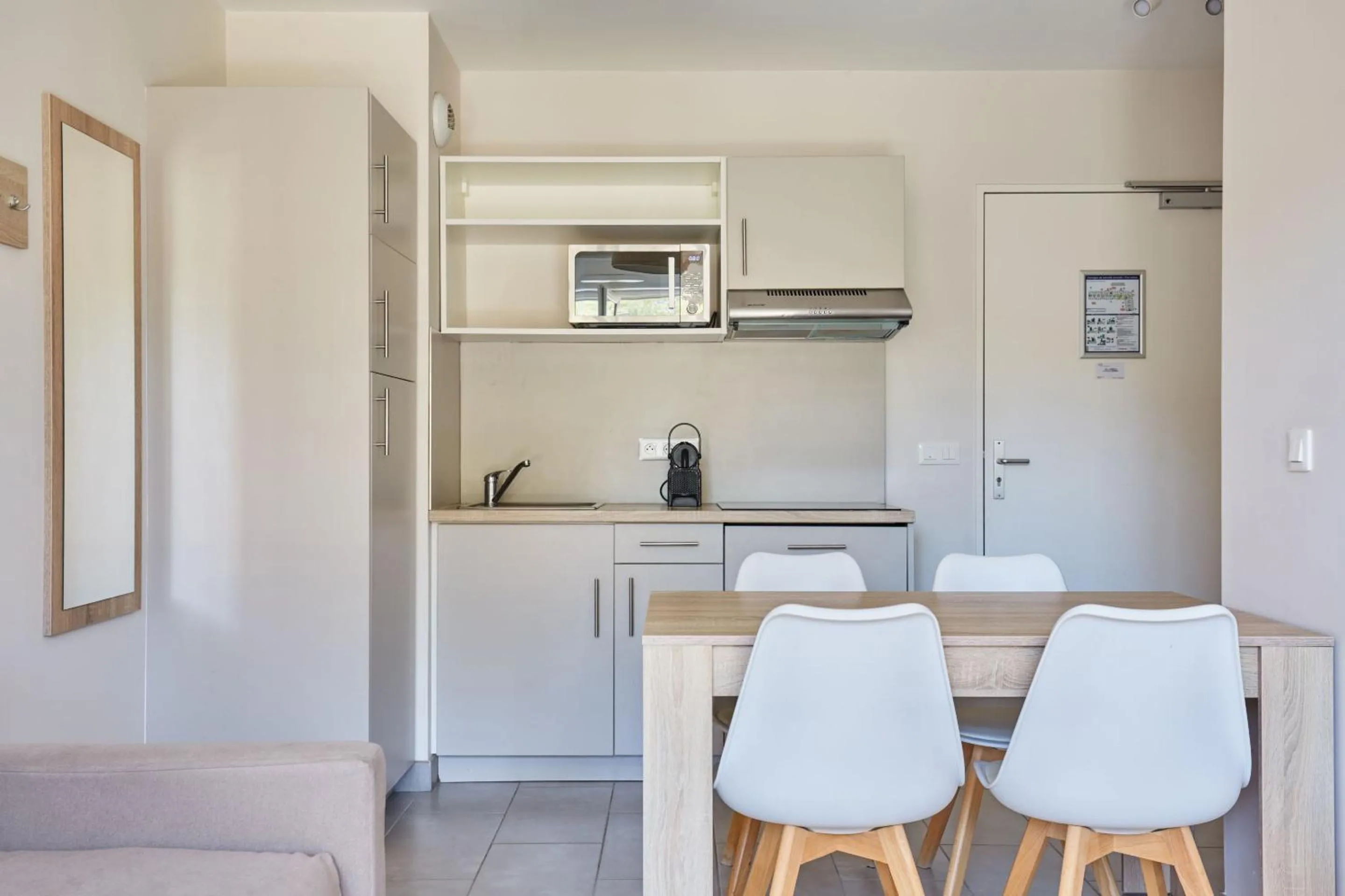 Kitchen or kitchenette in Odalys Résidence et Spa Les Canissons