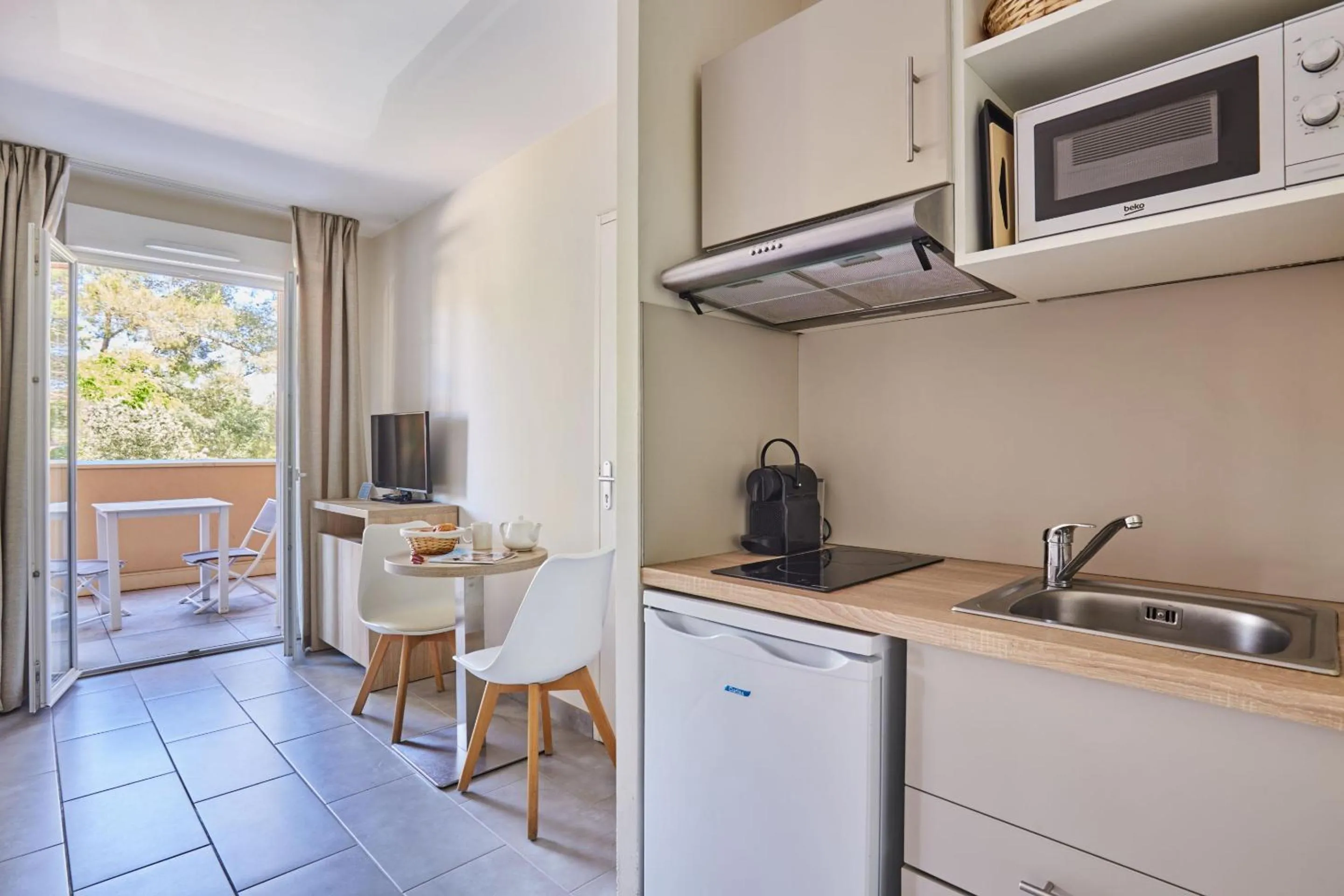 Kitchen or kitchenette in Odalys Résidence et Spa Les Canissons