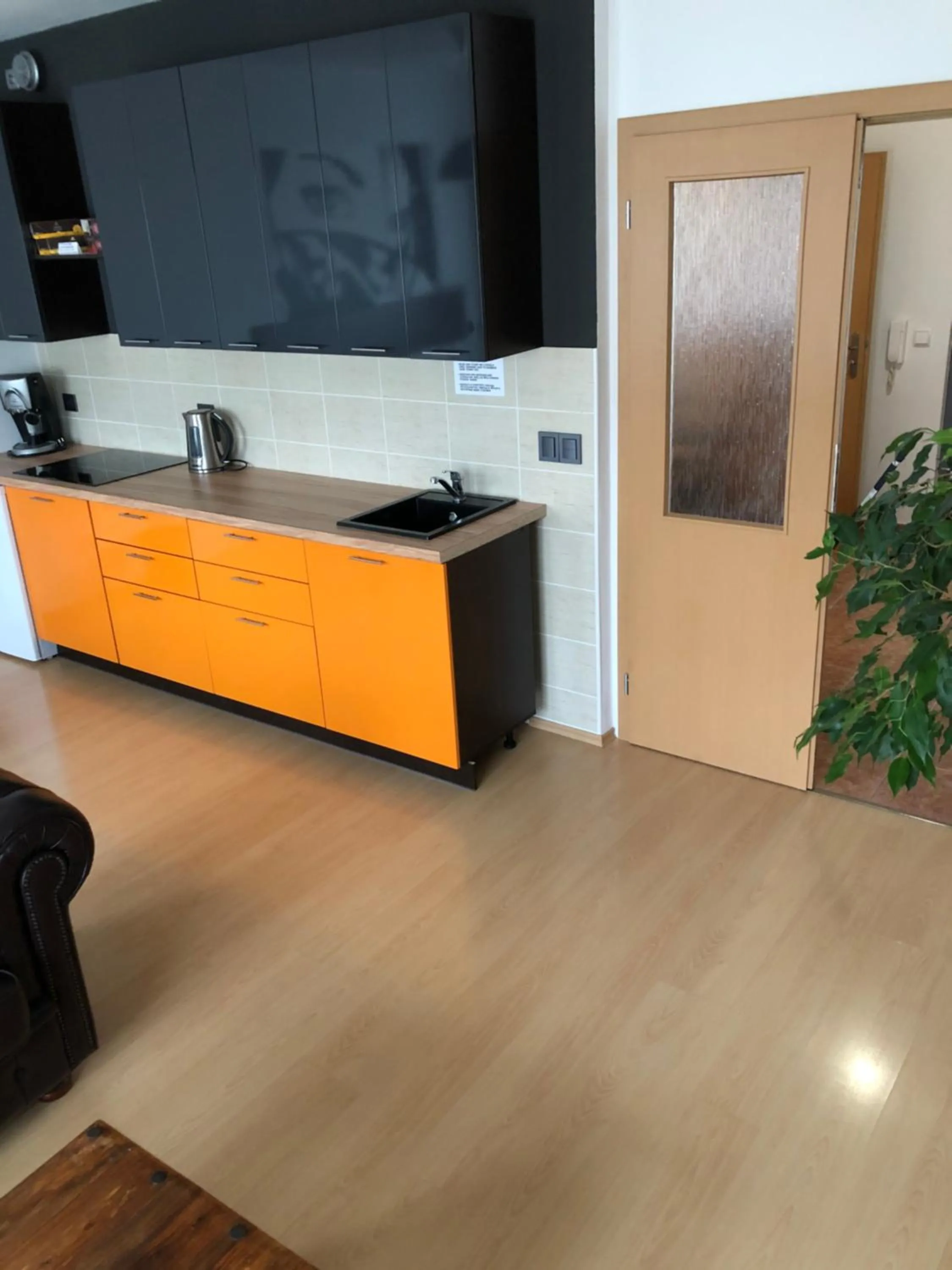 Communal lounge/ TV room in Richie Apartment near Aquapark