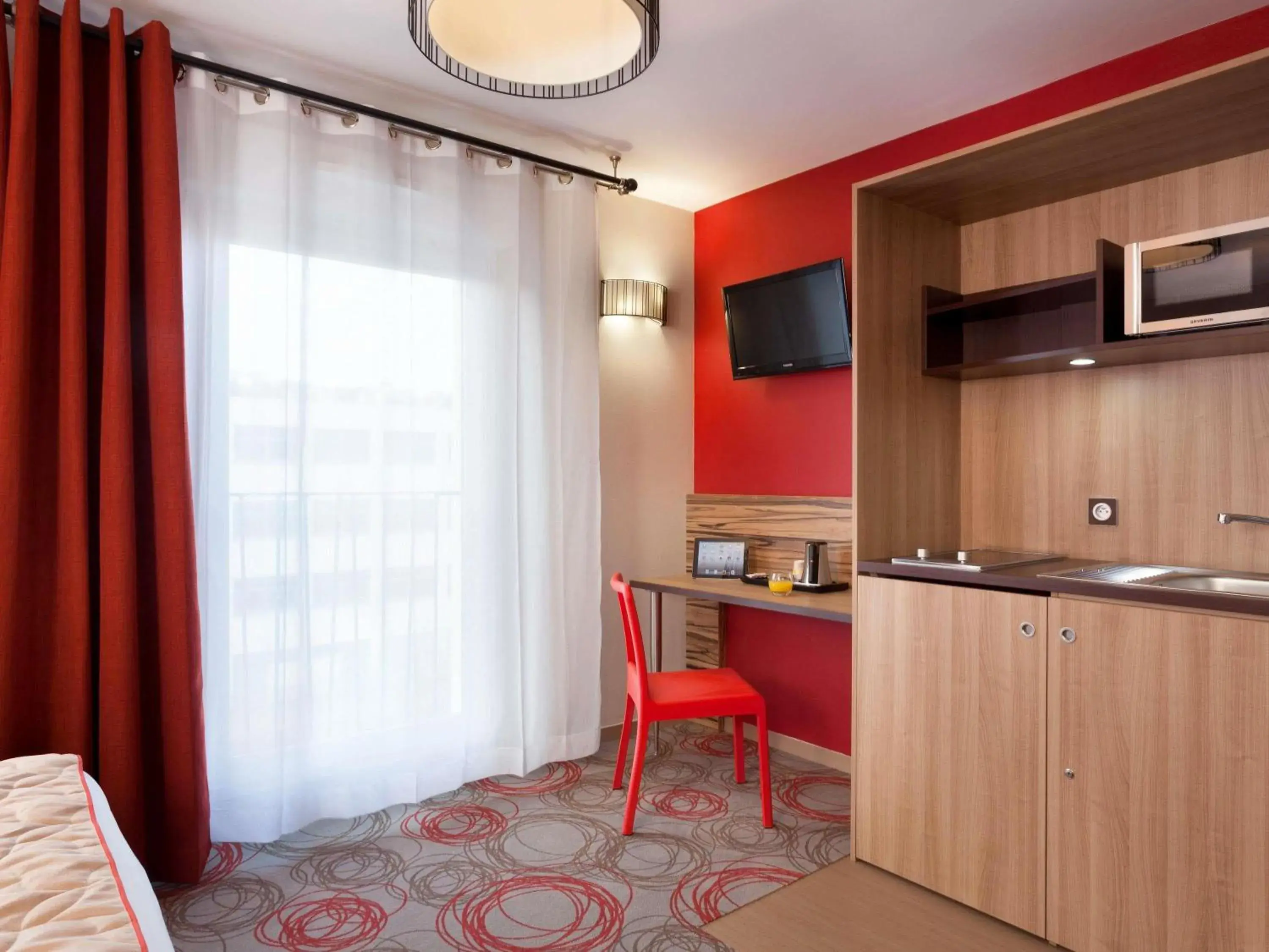 Bedroom in Aparthotel Adagio Lyon Patio Confluence Bedroom in Aparthotel Adagio Lyon Patio Confluence