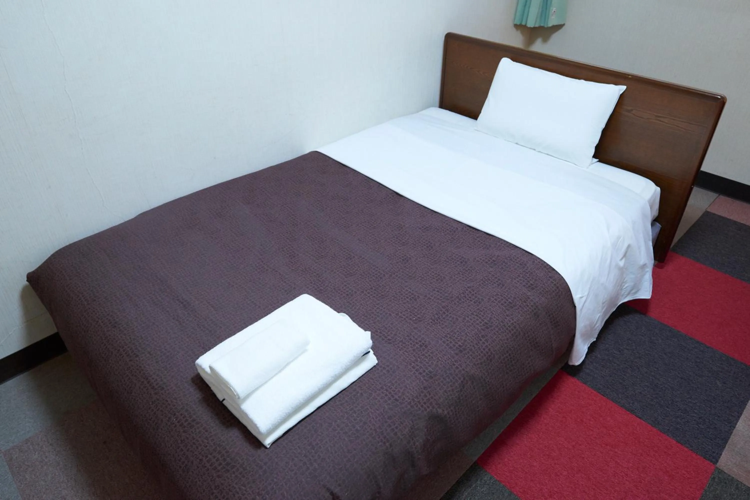 Bed in Hotel Select Inn Furukawa