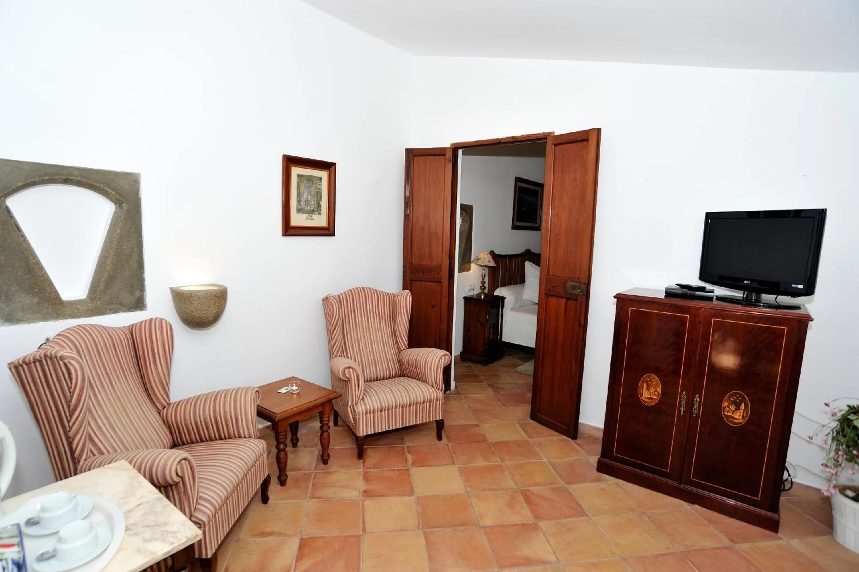 TV and multimedia in Petit Hotel Es Figueral