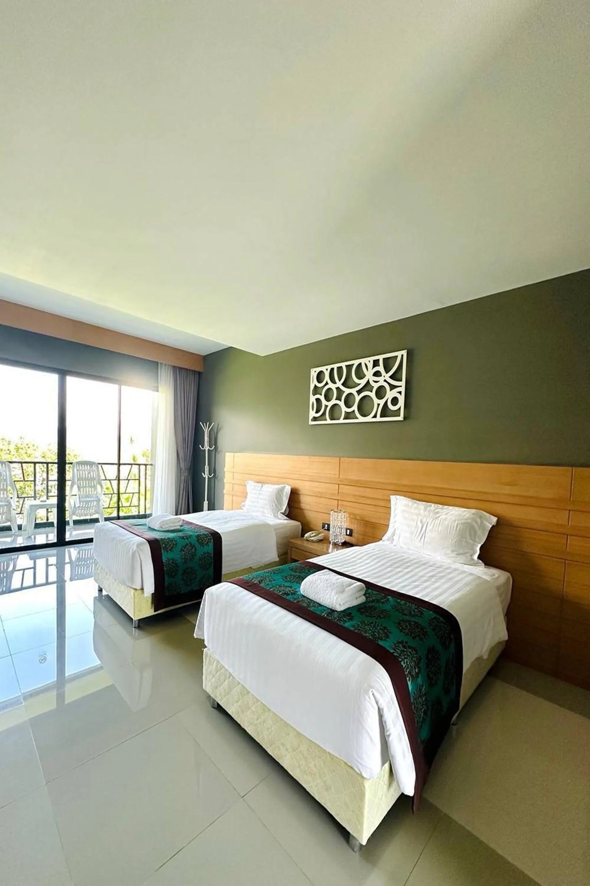 Bed in The Par Phuket SHA Plus