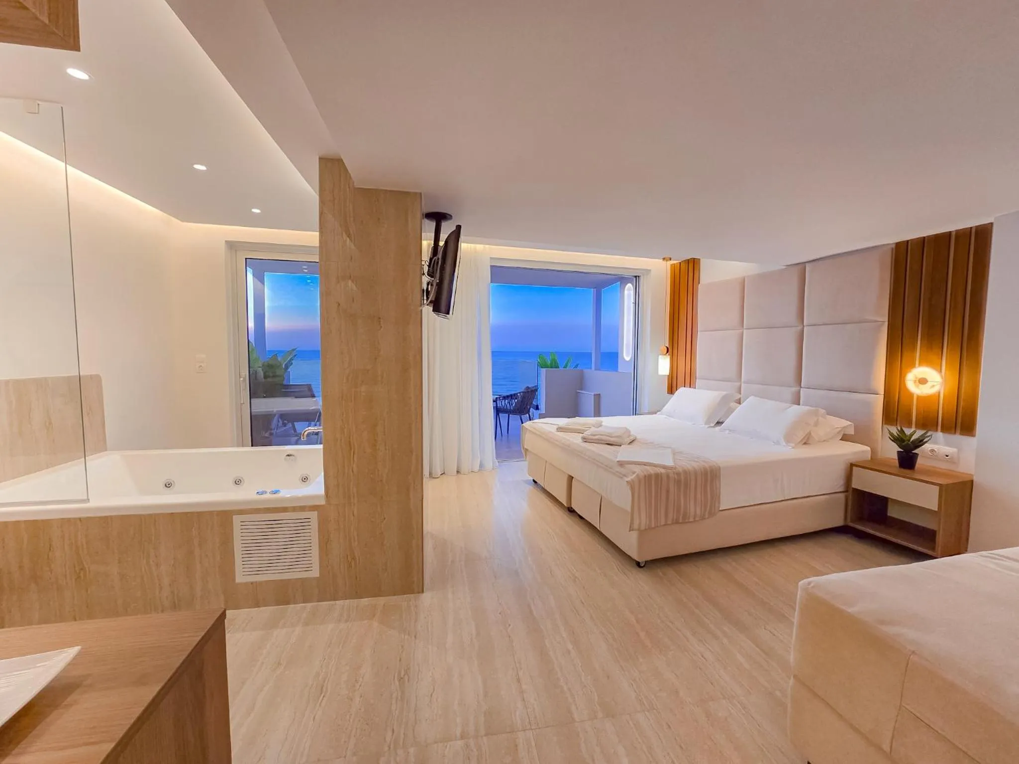 Bed in Theo Beach Hotel Apartments