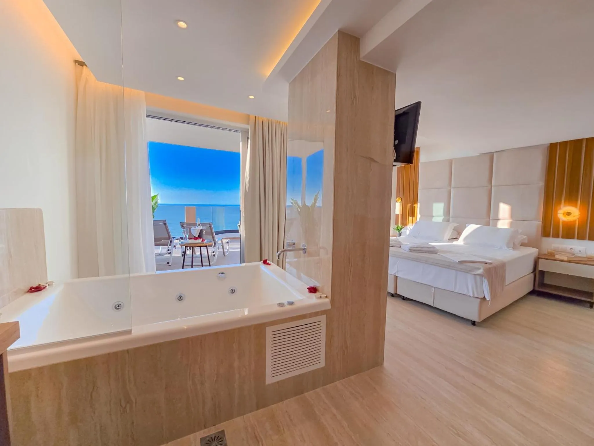 Bed in Theo Beach Hotel Apartments