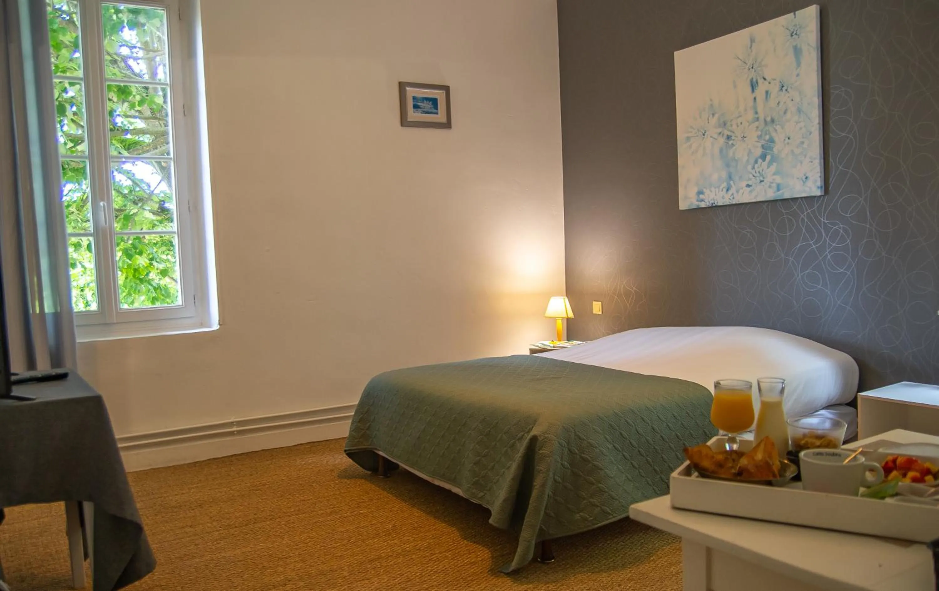 Bed in Logis Hotels - Au Colombier du Touron