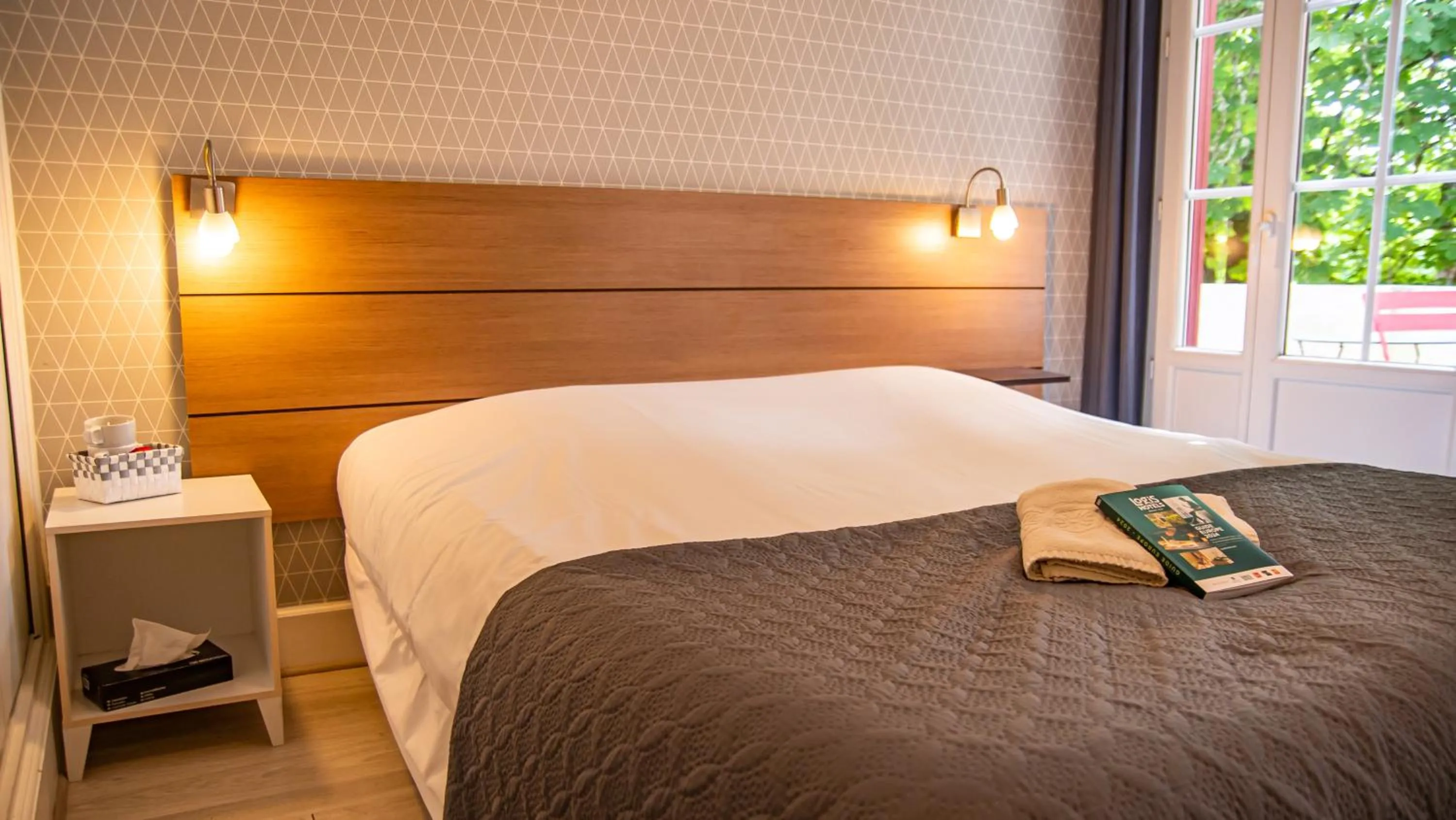 Bed in Logis Hotels - Au Colombier du Touron