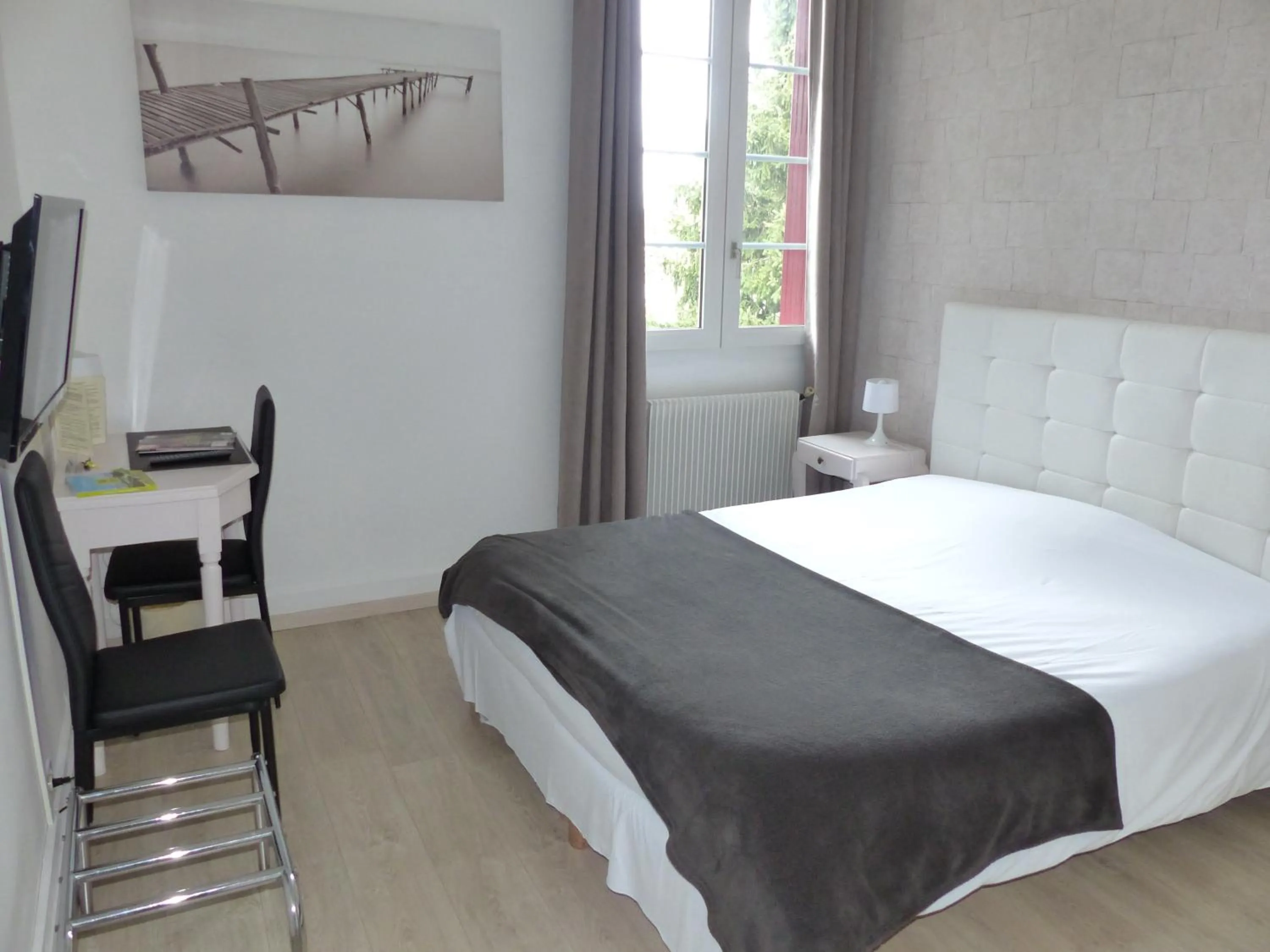 Bedroom, Bed in Logis Hotels - Au Colombier du Touron