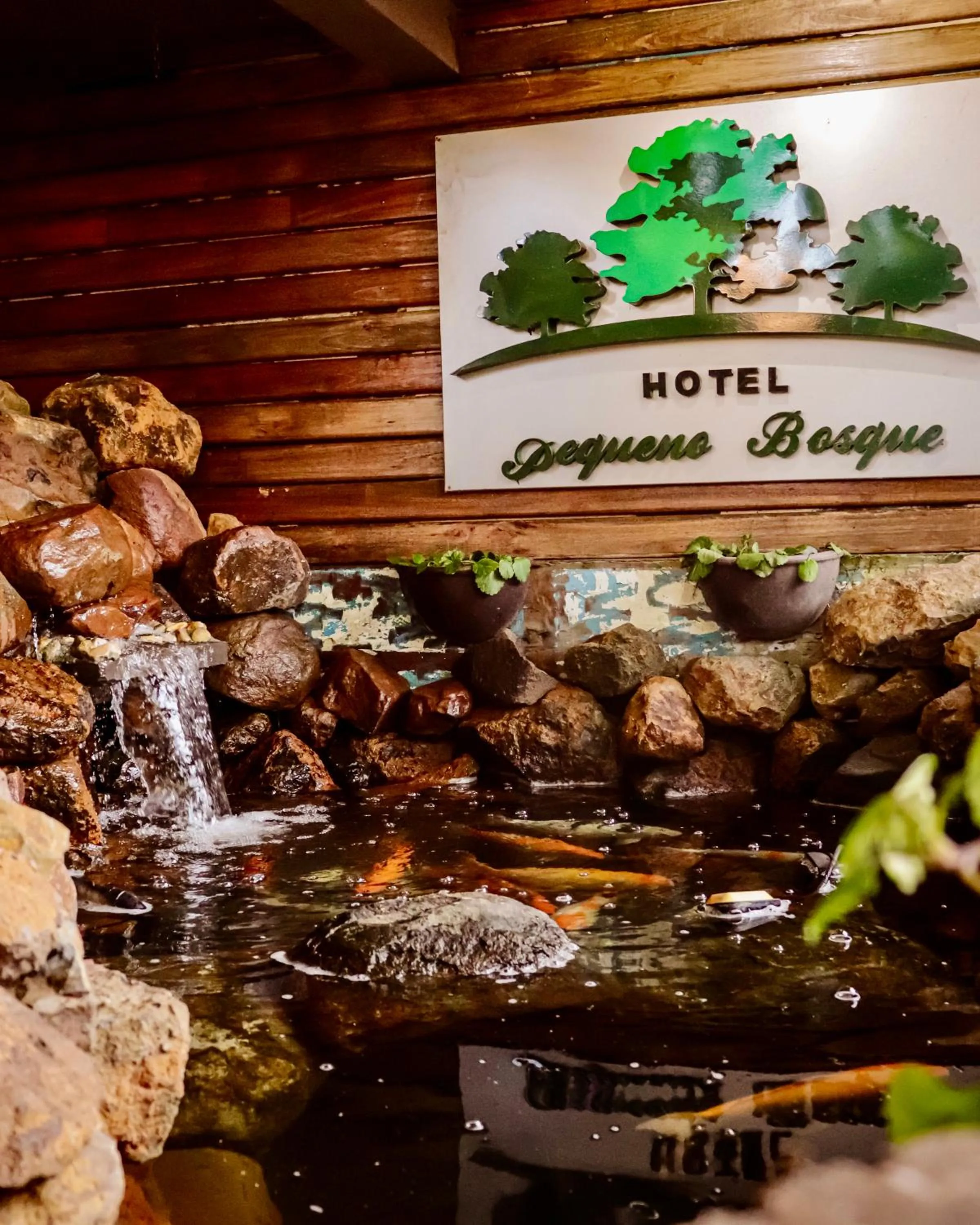 Property logo or sign in Hotel Pequeno Bosque