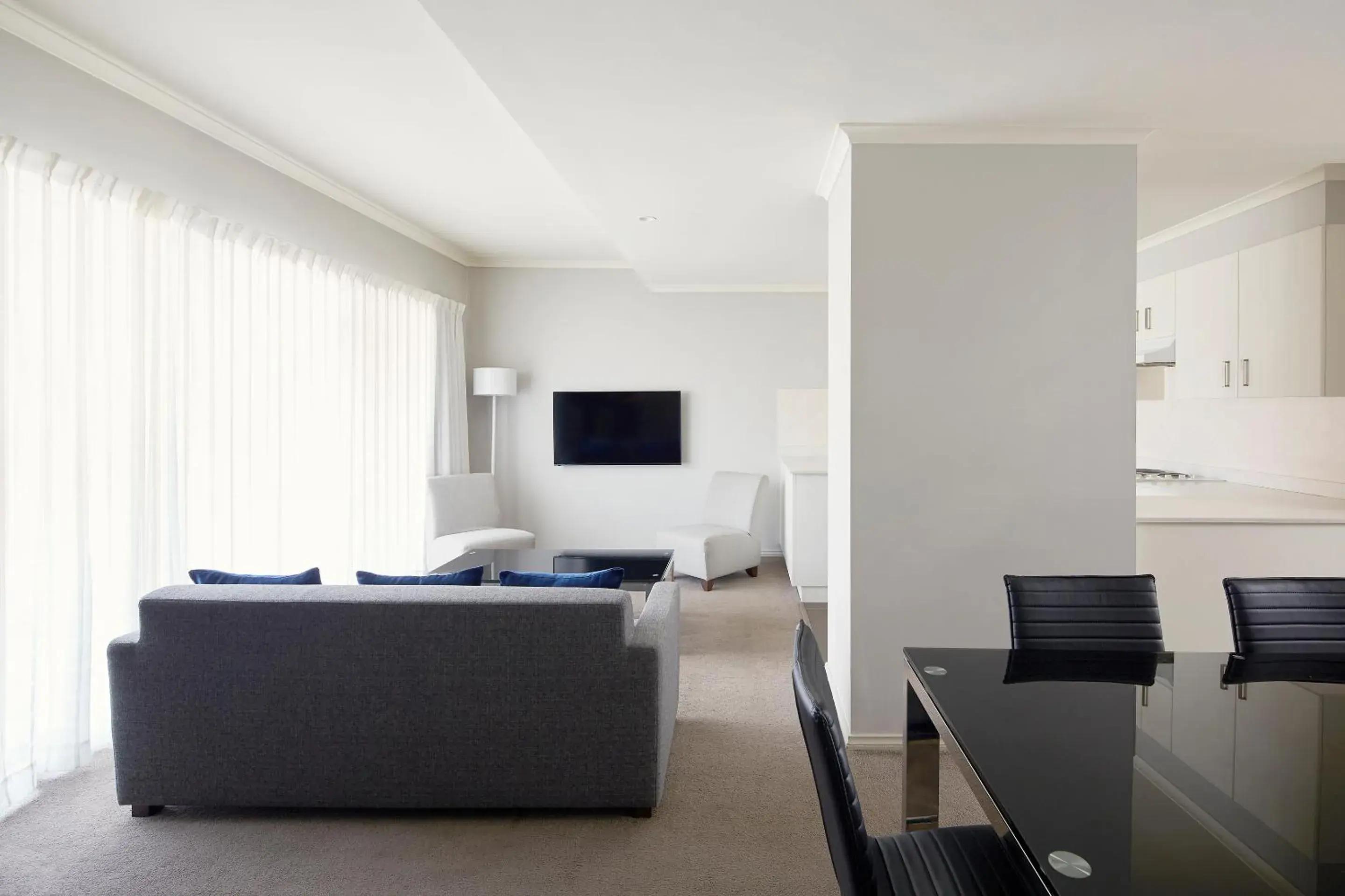 Seating area, Bed in Pinnacle Apartments Seating area, Bed in Pinnacle Apartments