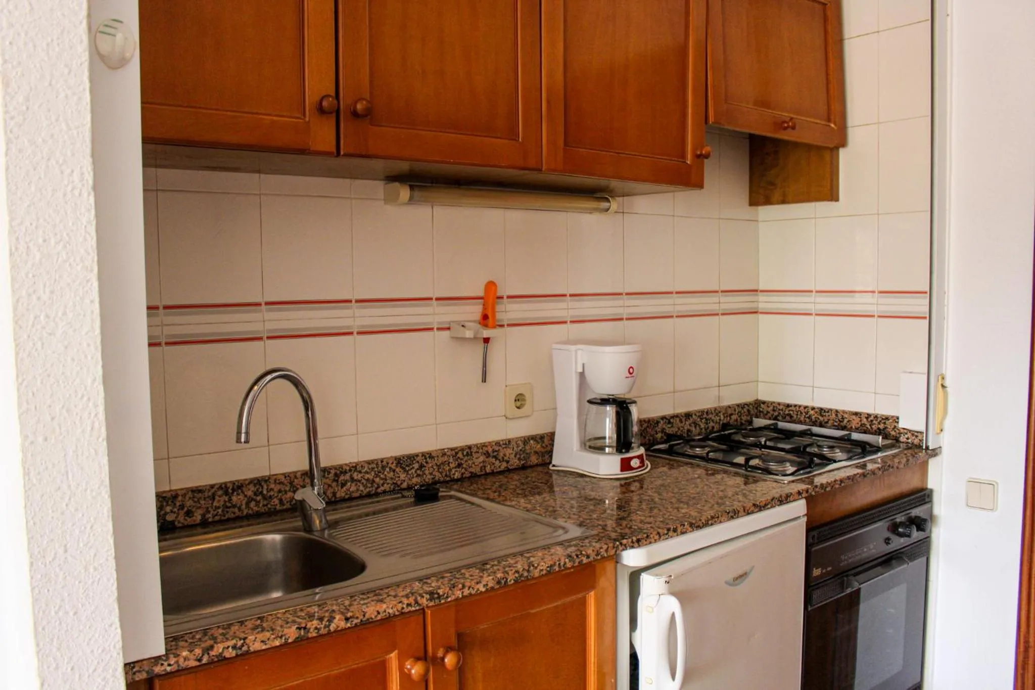 Kitchen or kitchenette in Apartamentos Esmeralda Unitursa