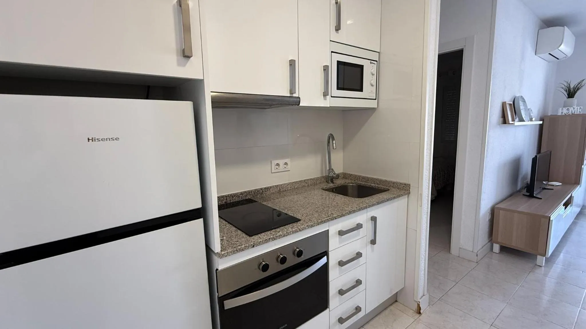Kitchen or kitchenette in Apartamentos Esmeralda Unitursa