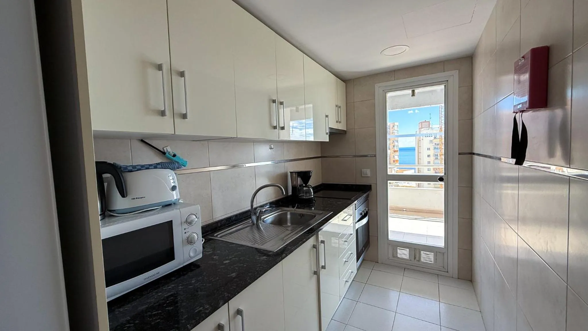 Kitchen or kitchenette in Apartamentos Esmeralda Unitursa