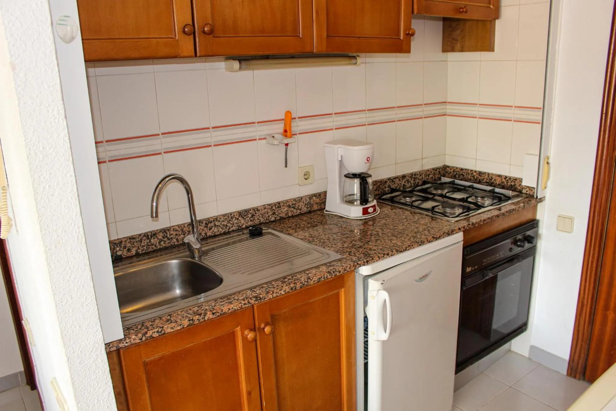 Kitchen or kitchenette in Apartamentos Esmeralda Unitursa
