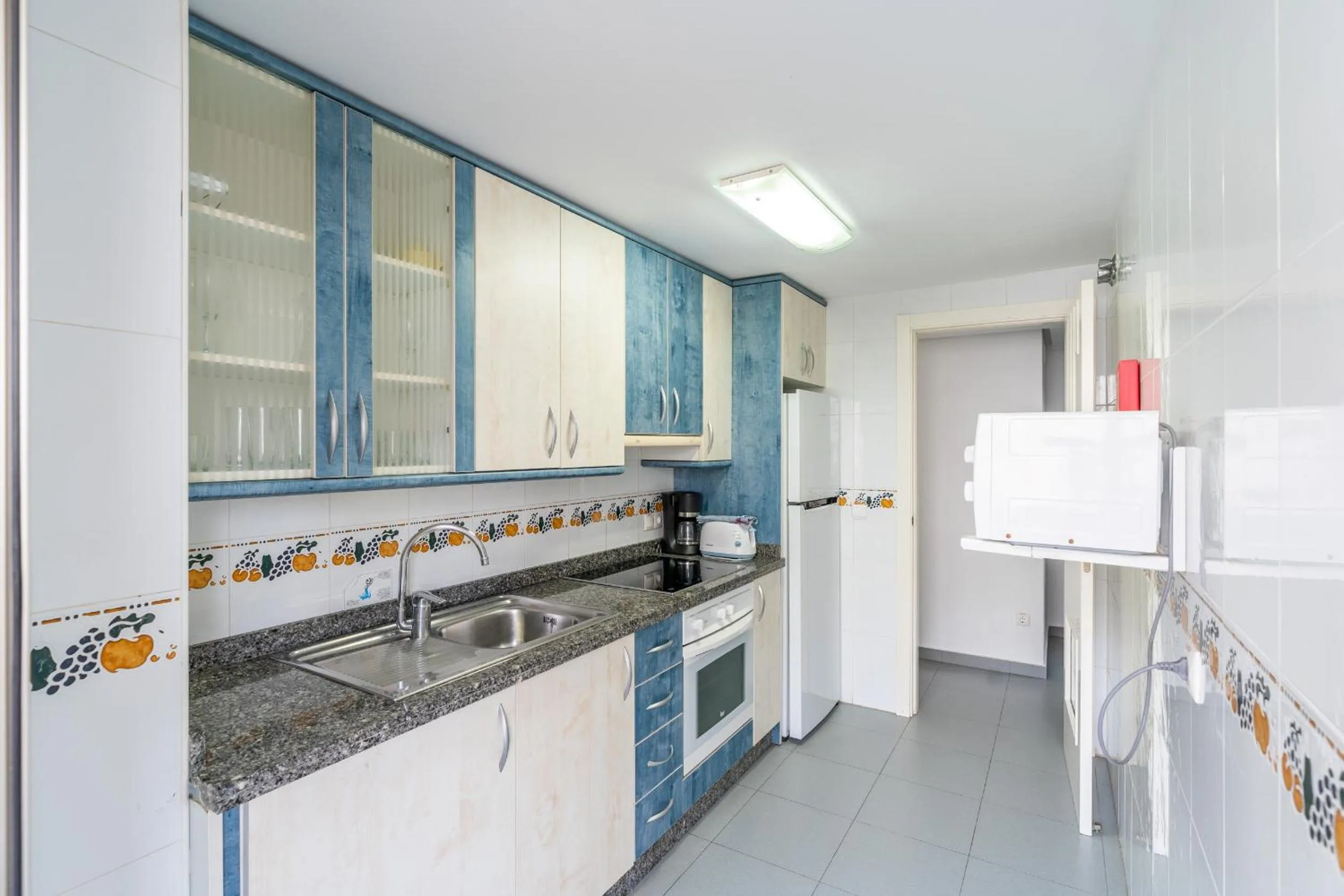 Kitchen or kitchenette in Apartamentos Hipocampos Unitursa