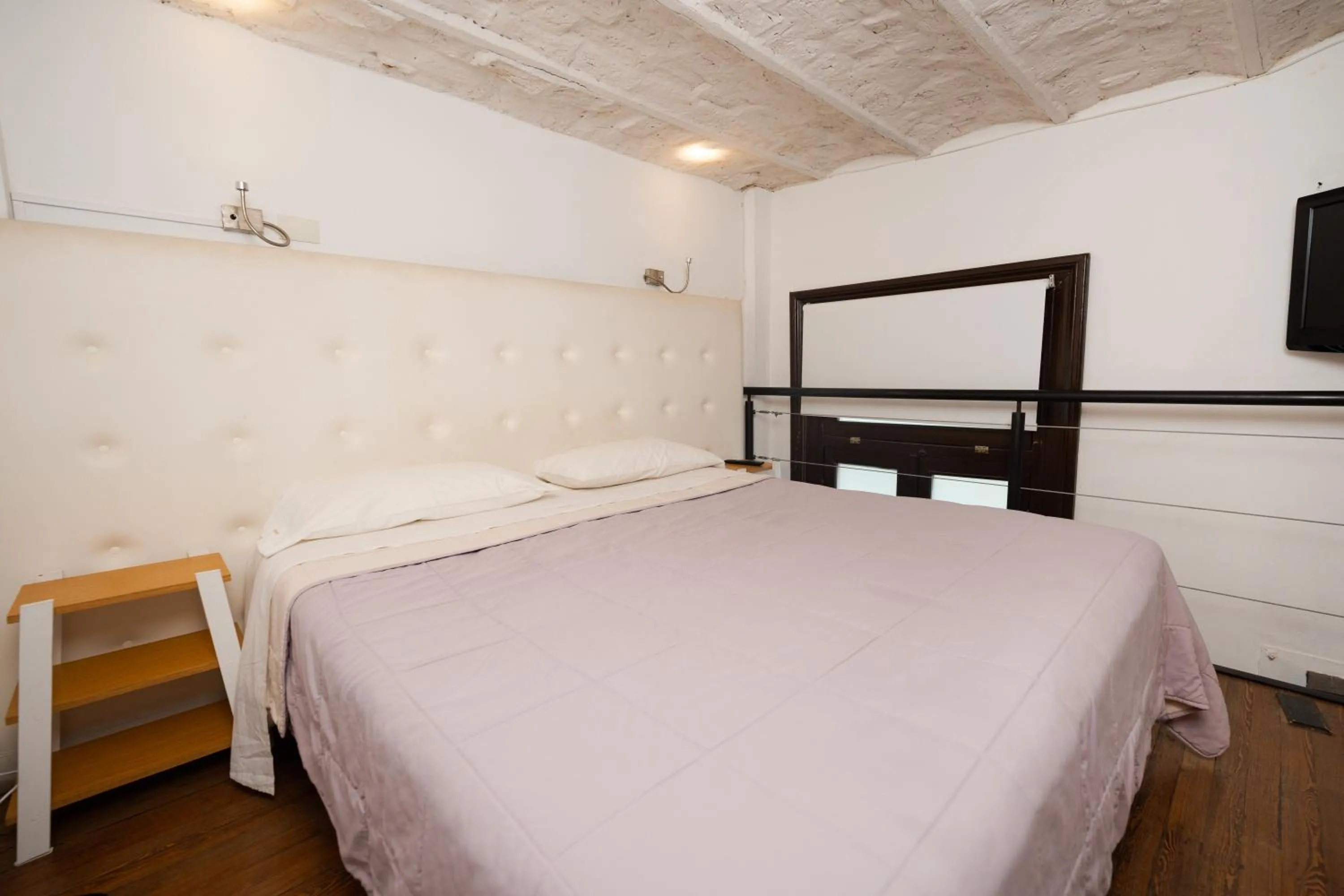 Bed in Loft Osteria by Sagardi