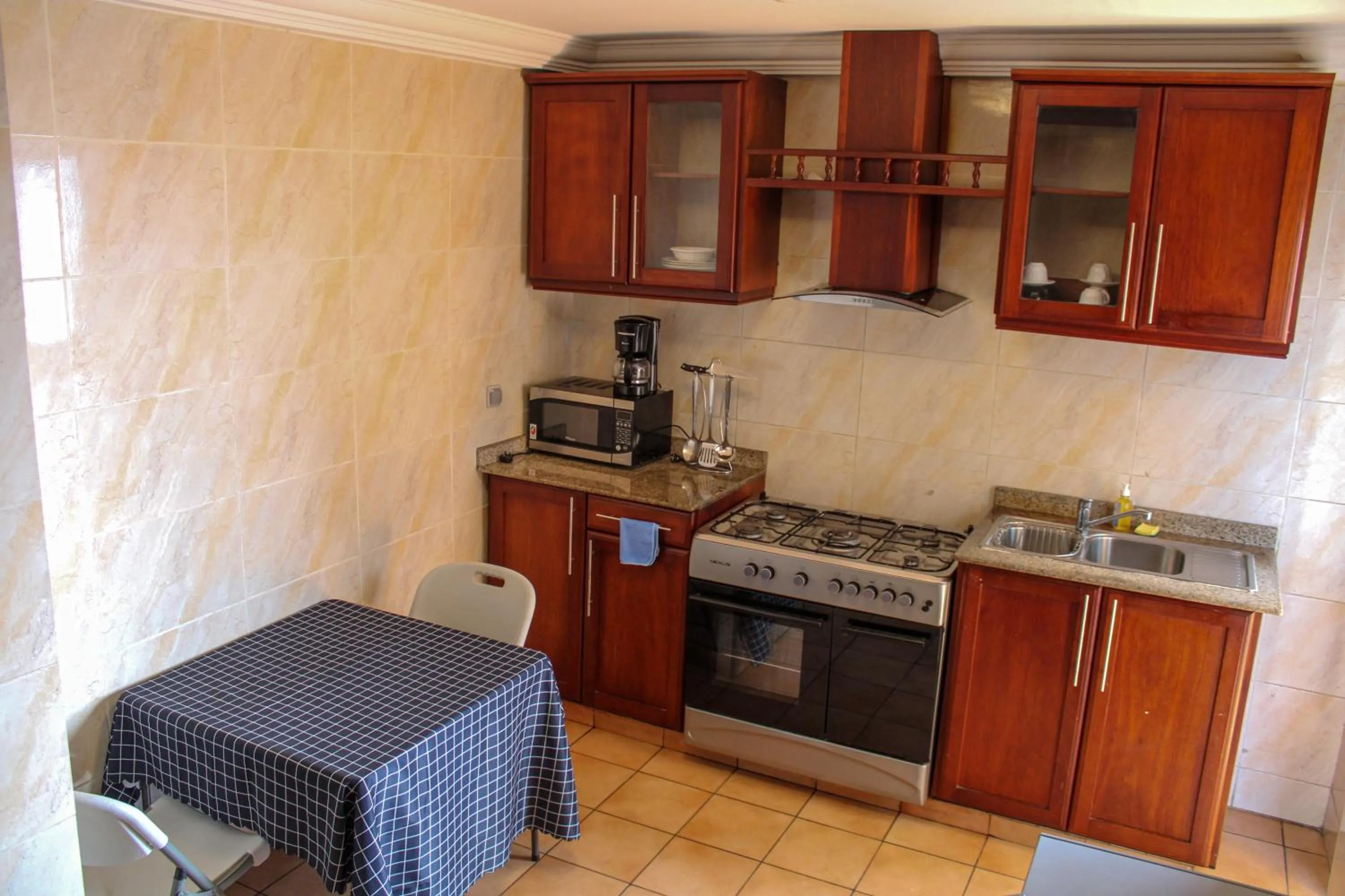 Kitchen or kitchenette in Residence Le Carat Bonapriso