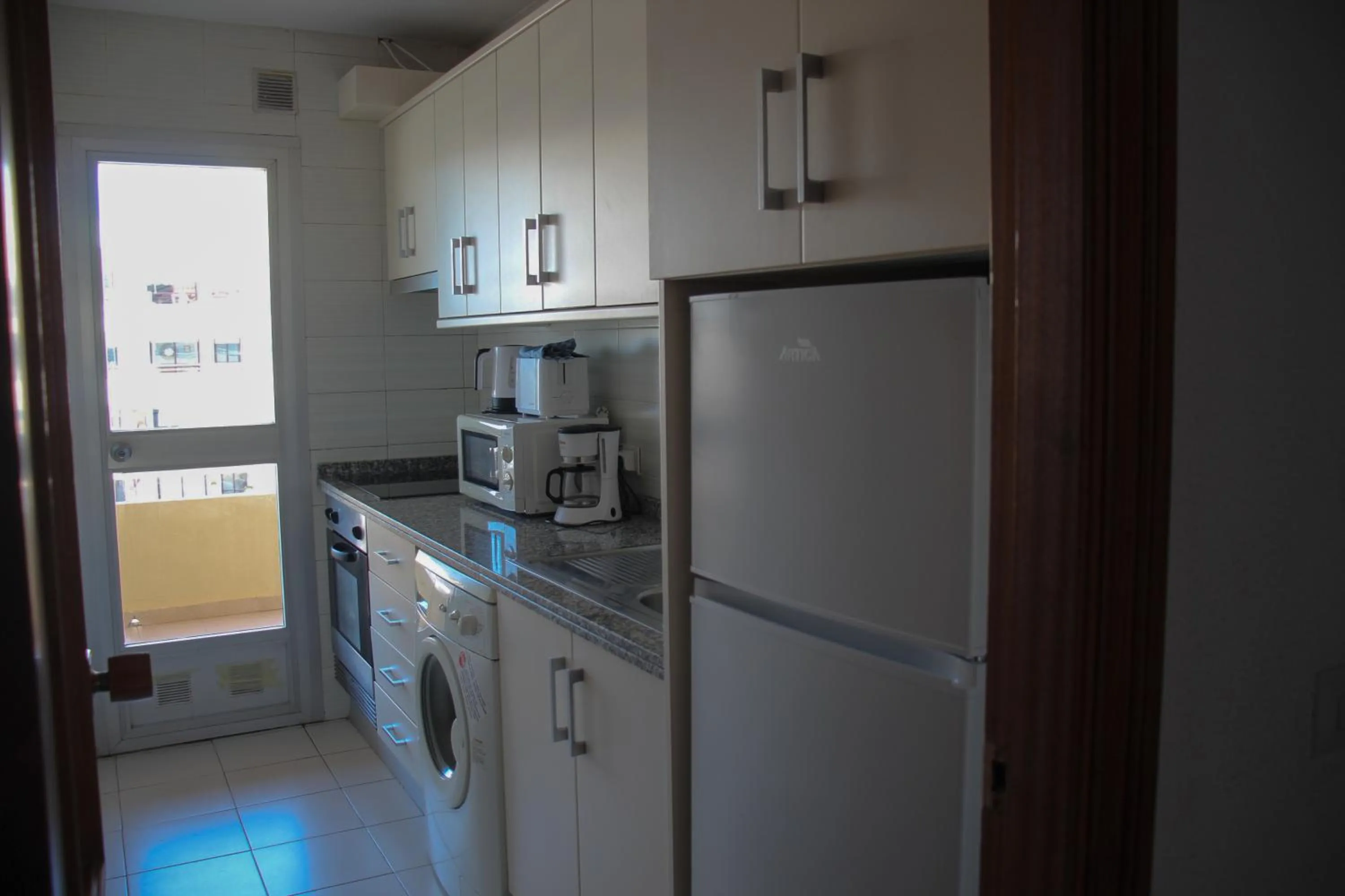 Kitchen or kitchenette in Apartamentos Turmalina Unitursa