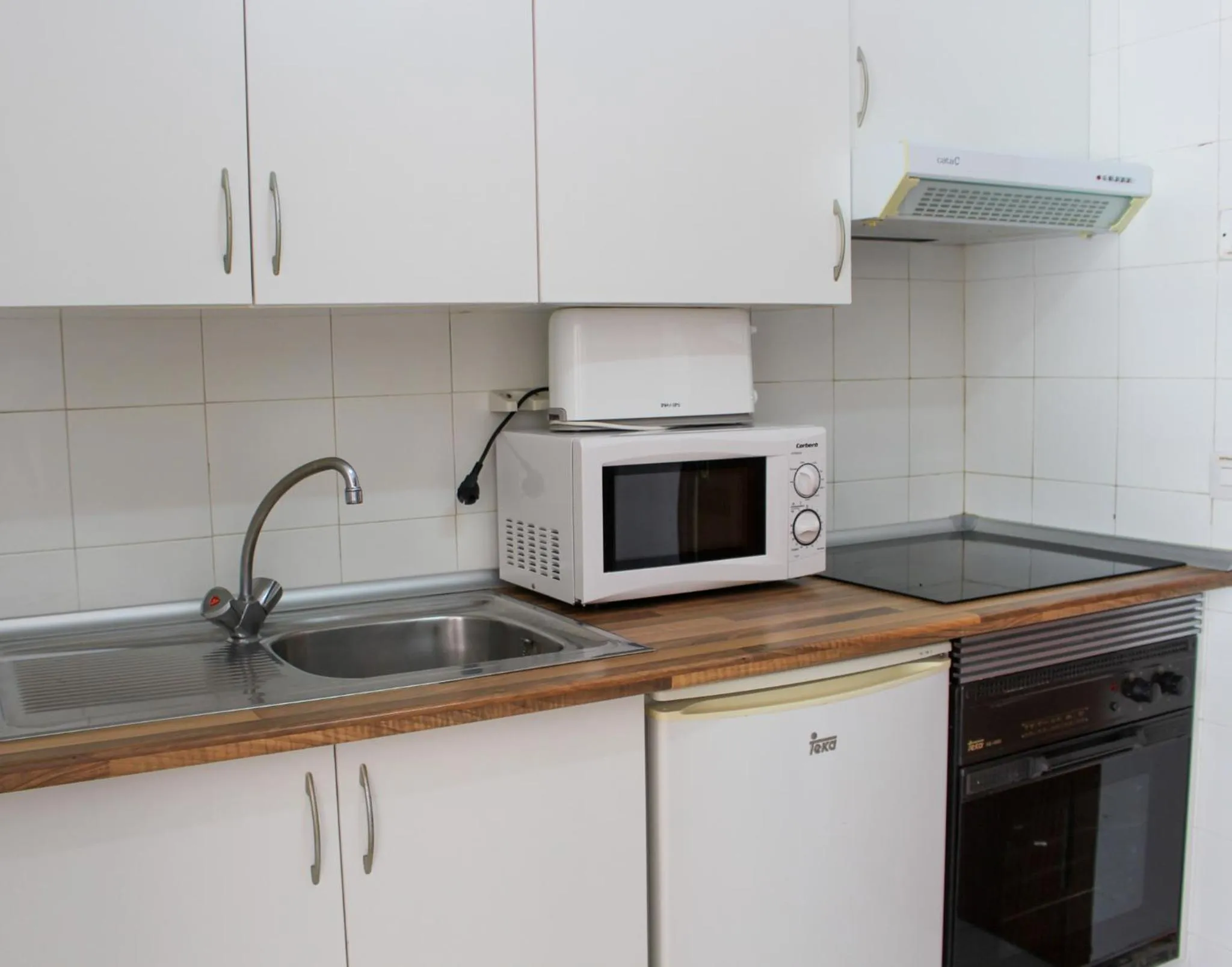 Kitchen or kitchenette in Apartamentos Turmalina Unitursa