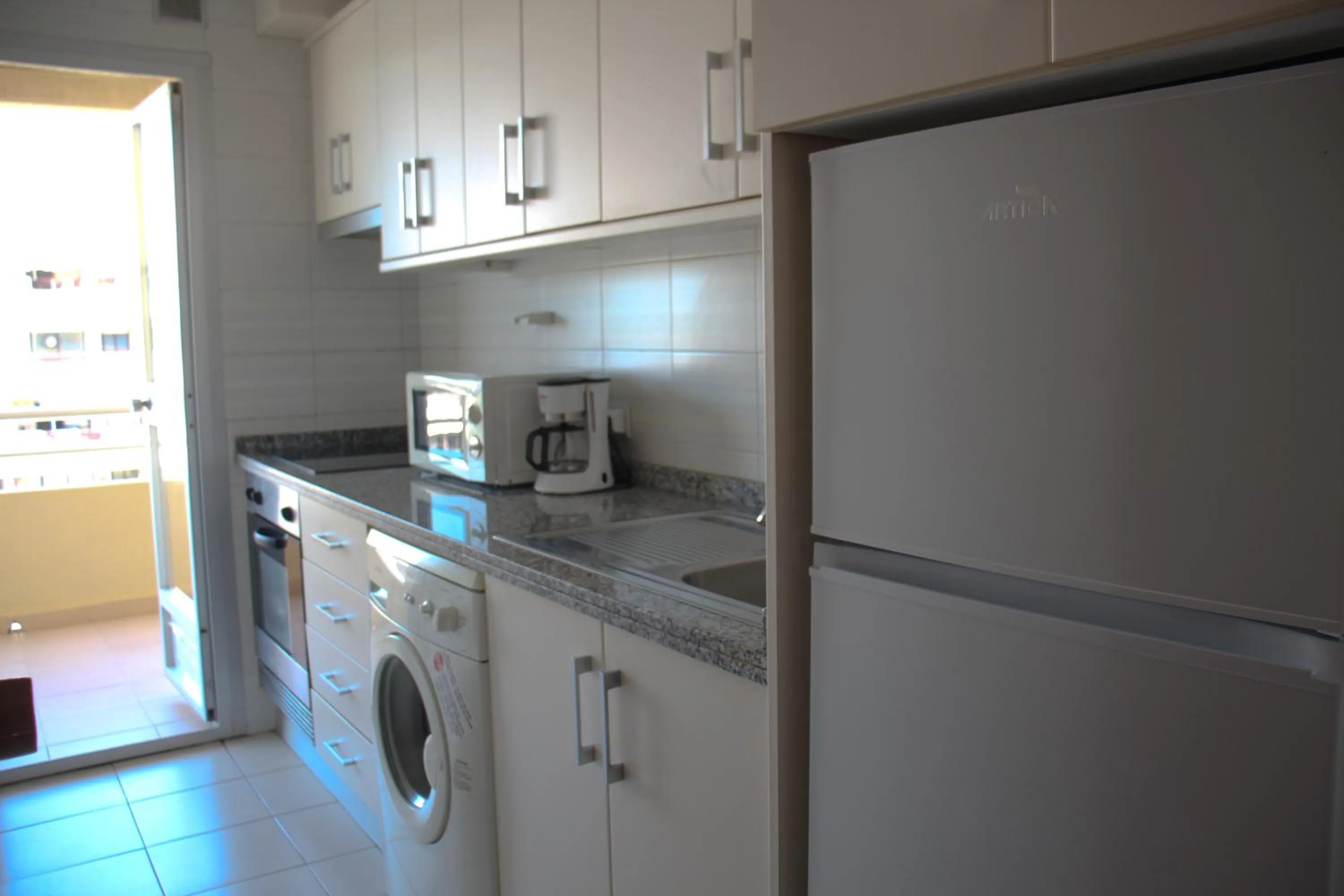 Kitchen or kitchenette in Apartamentos Turmalina Unitursa