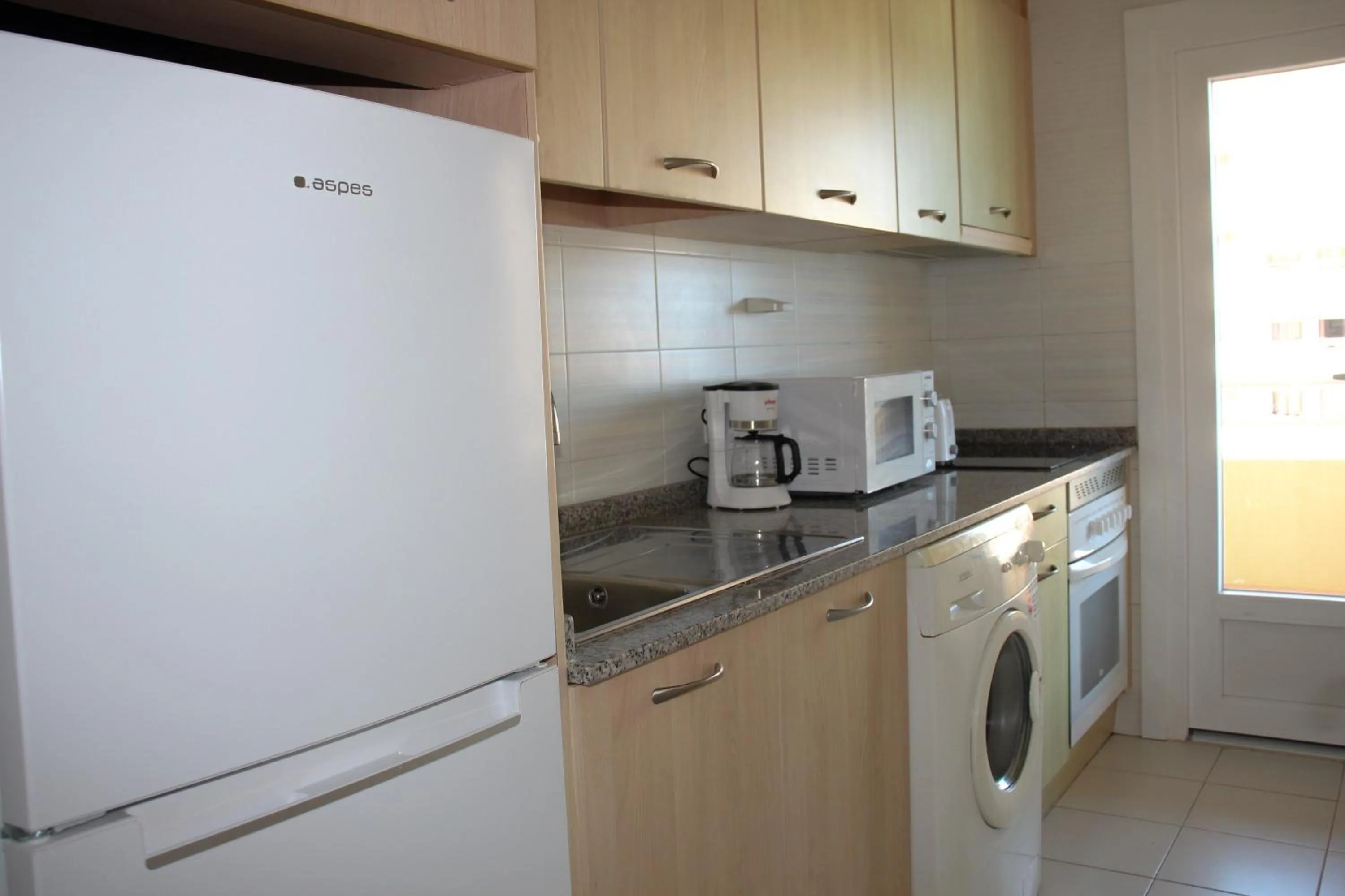 Kitchen or kitchenette in Apartamentos Turmalina Unitursa