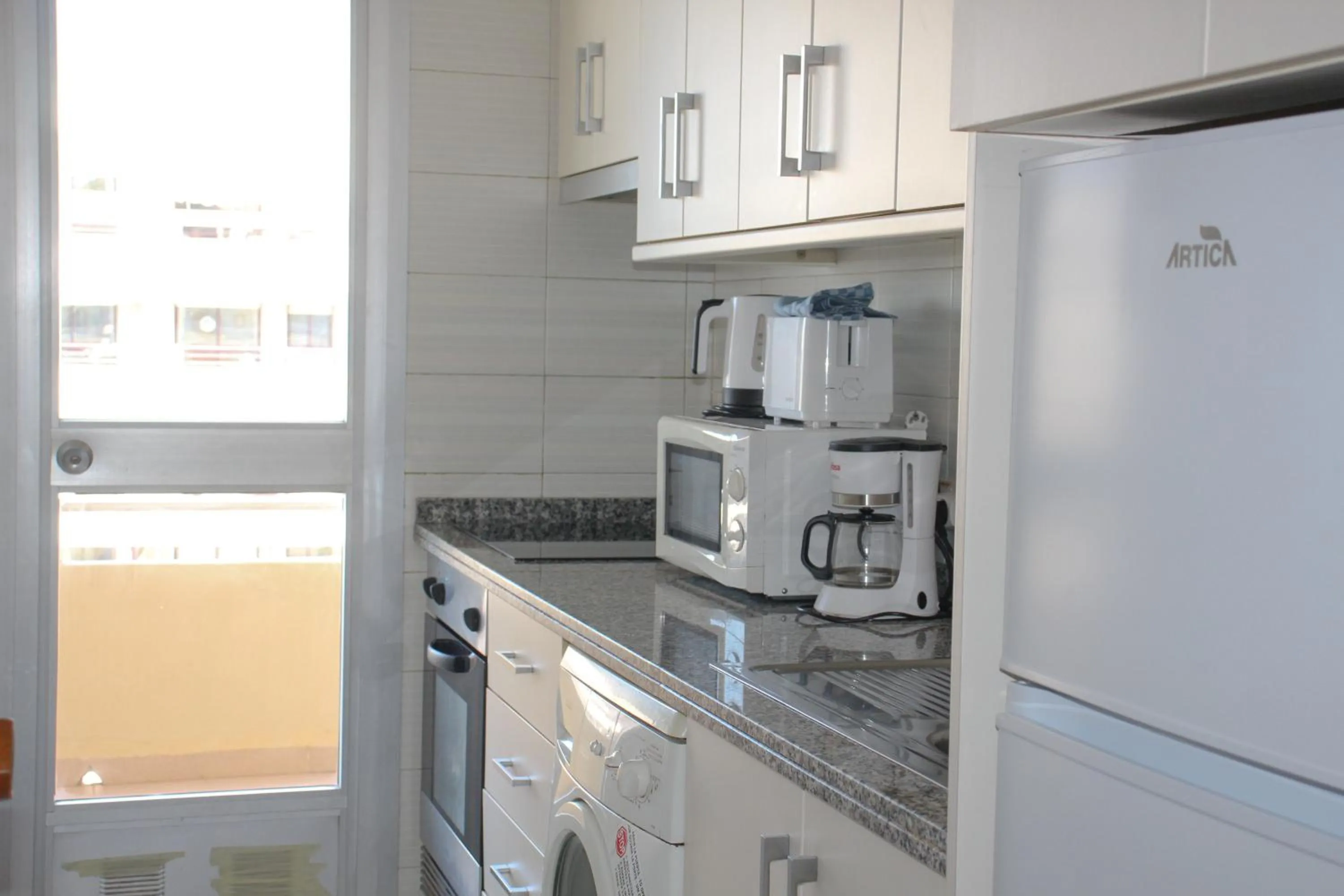 Kitchen or kitchenette in Apartamentos Turmalina Unitursa