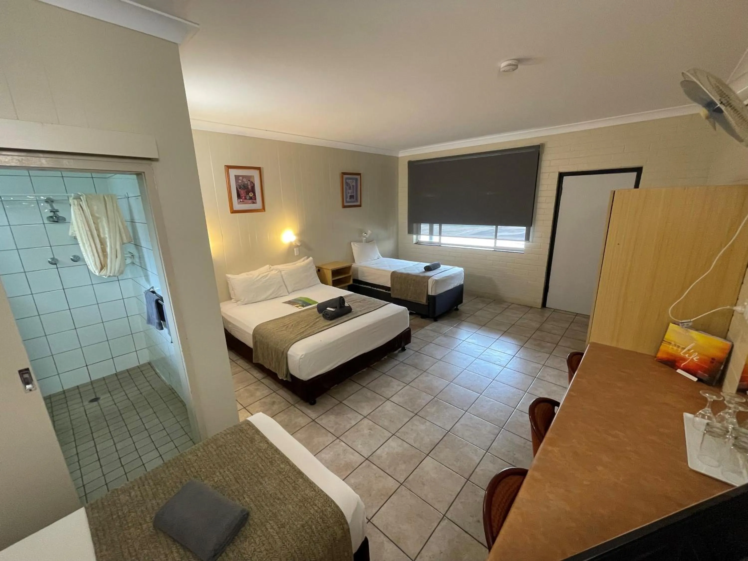 Shower, Bed in Pine Tree Motel