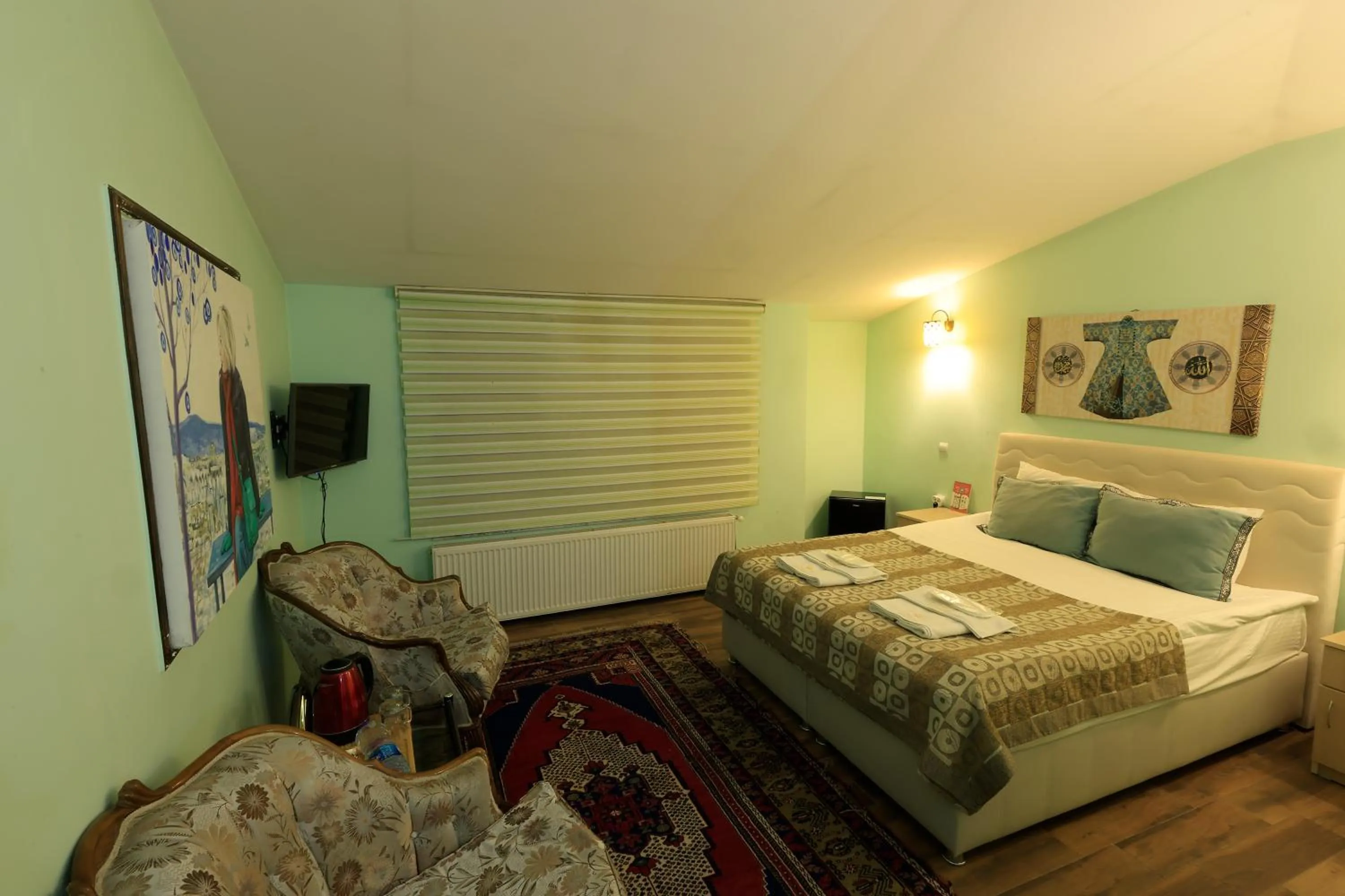 Photo of the whole room, Bed in KEMAL STONE HOUSE HOTEL.