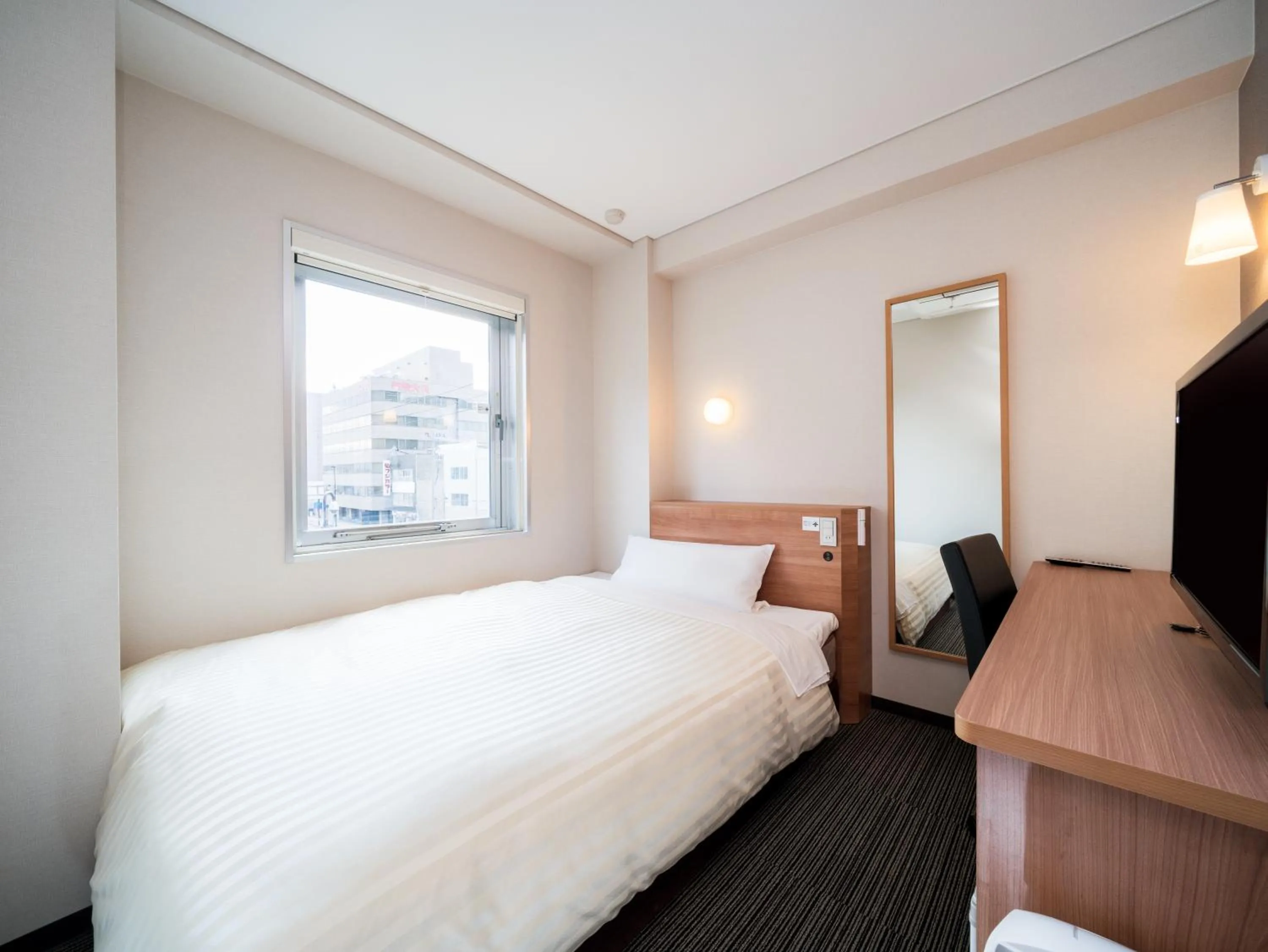 Bed in Super Hotel Aomori