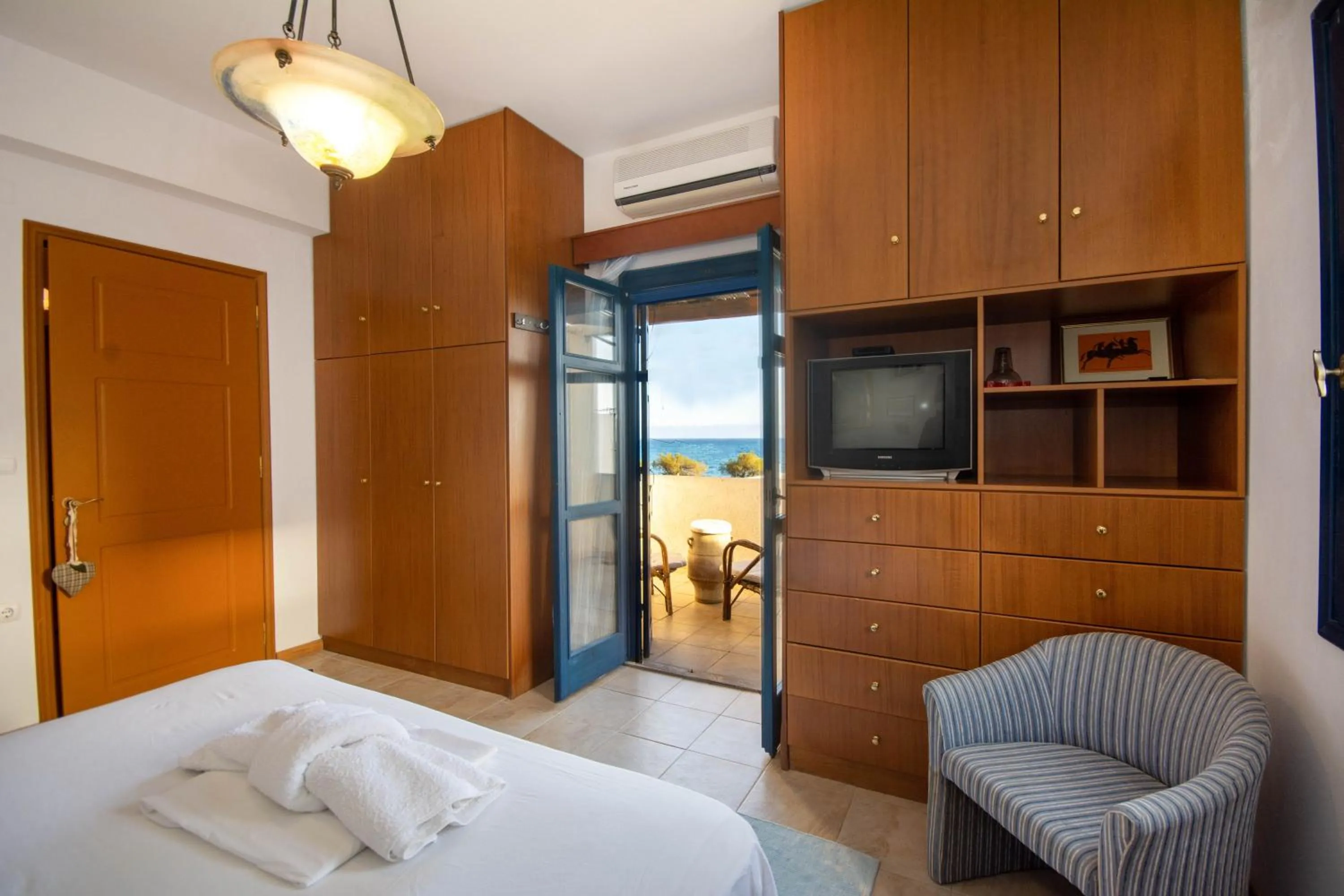 Bed in Triton Authentic Cretan Hotel