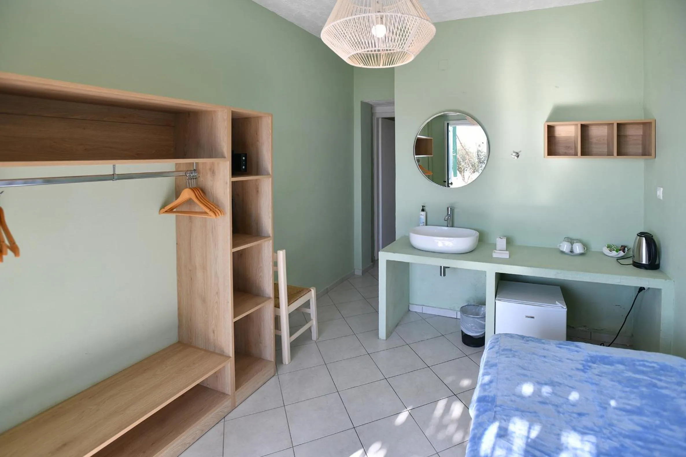 Bed in Triton Authentic Cretan Hotel