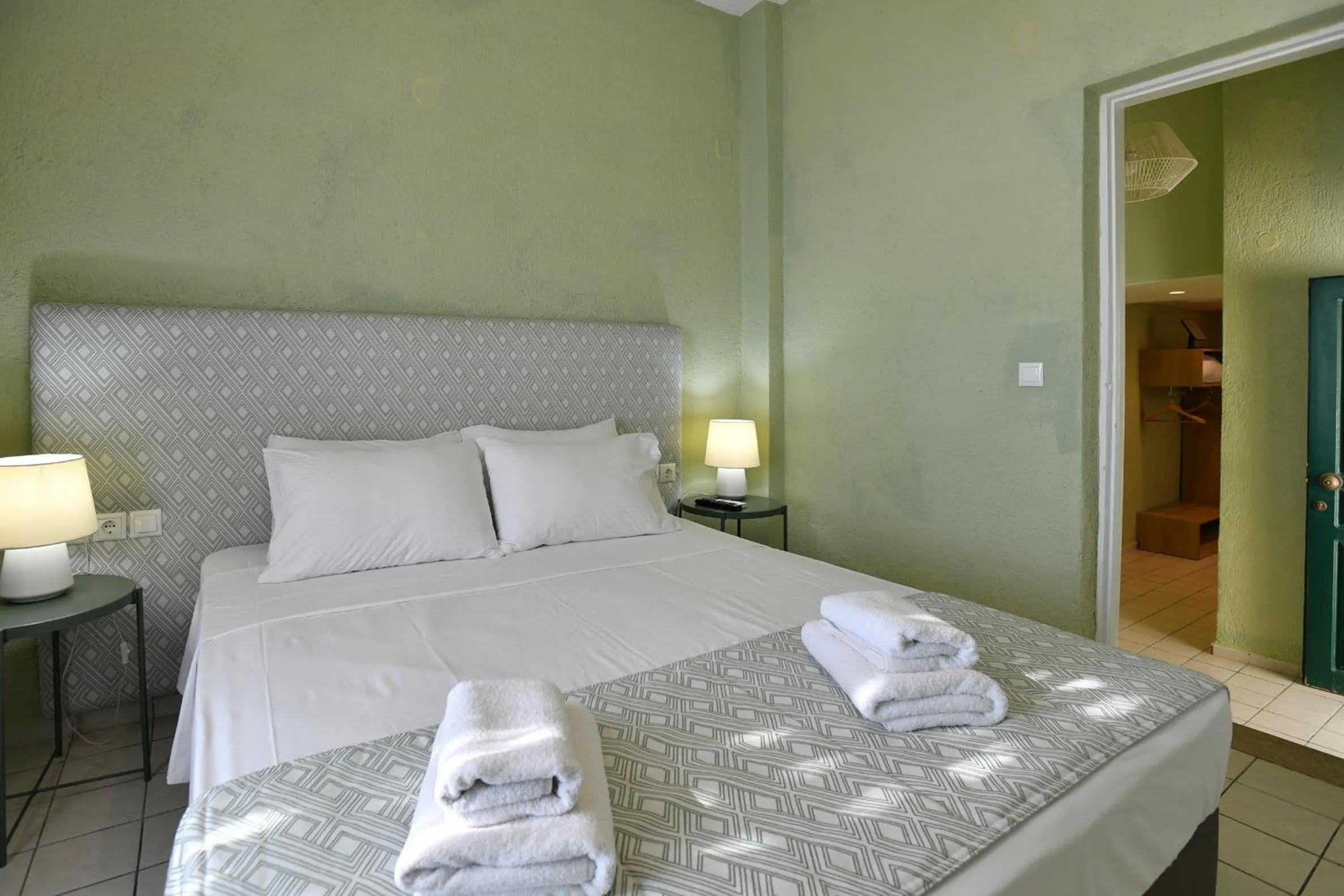 Bed in Triton Authentic Cretan Hotel