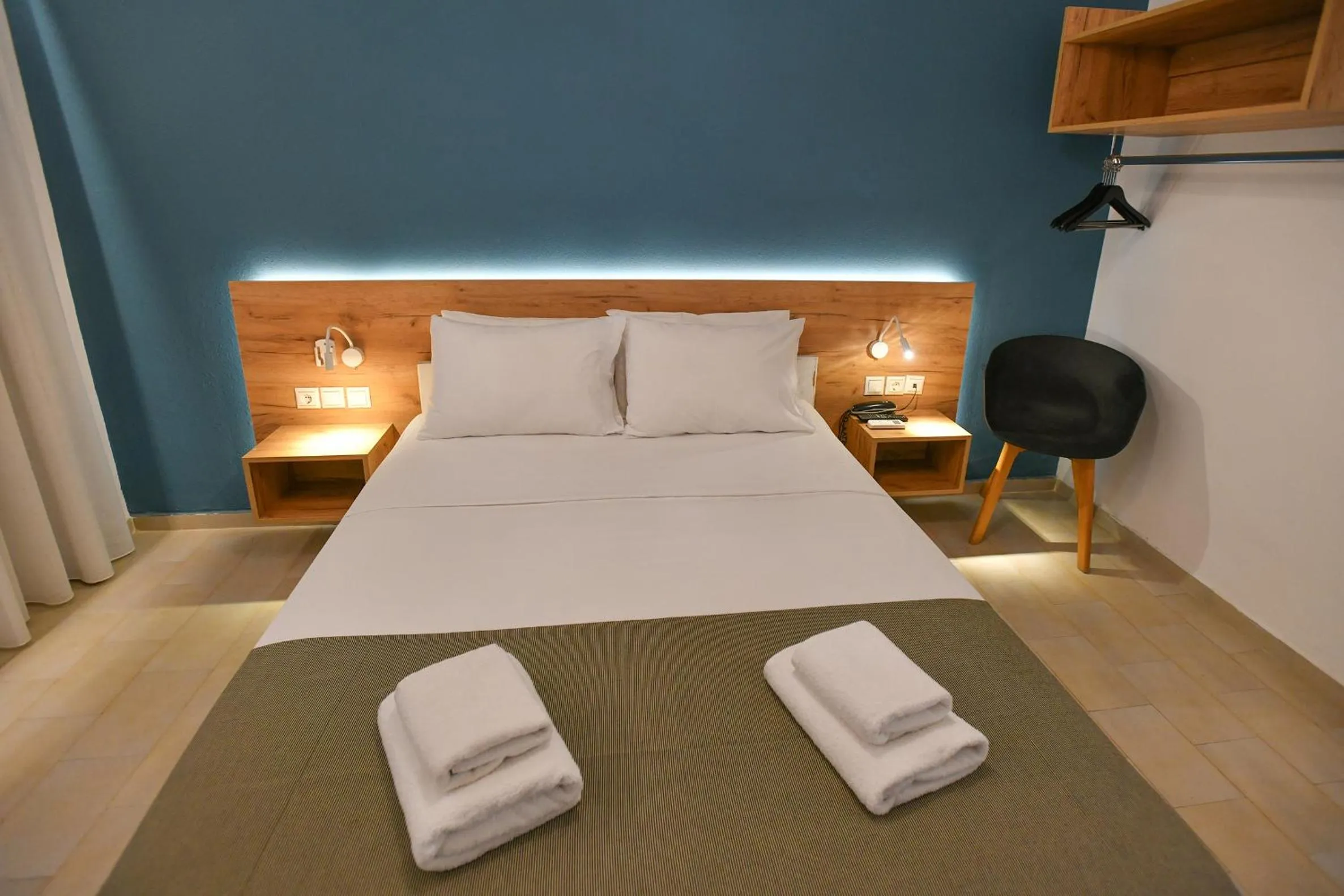 Bed in Triton Authentic Cretan Hotel