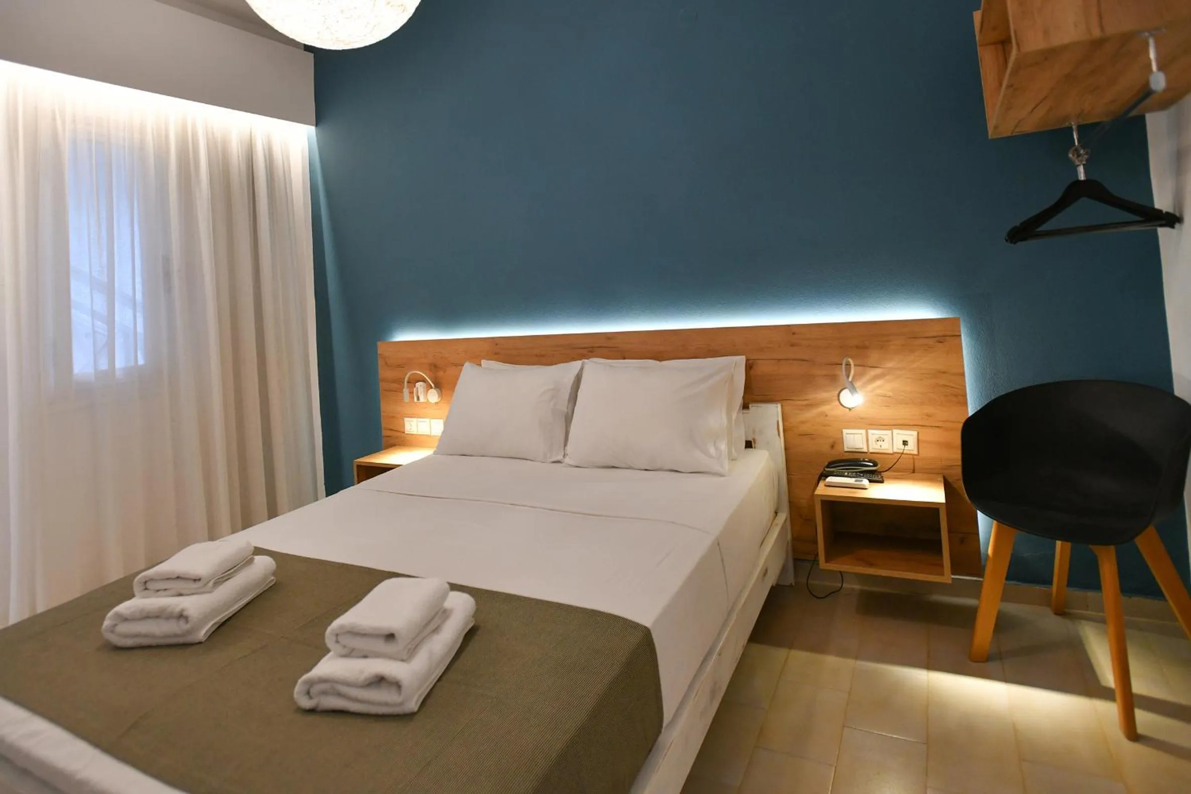 Bed in Triton Authentic Cretan Hotel