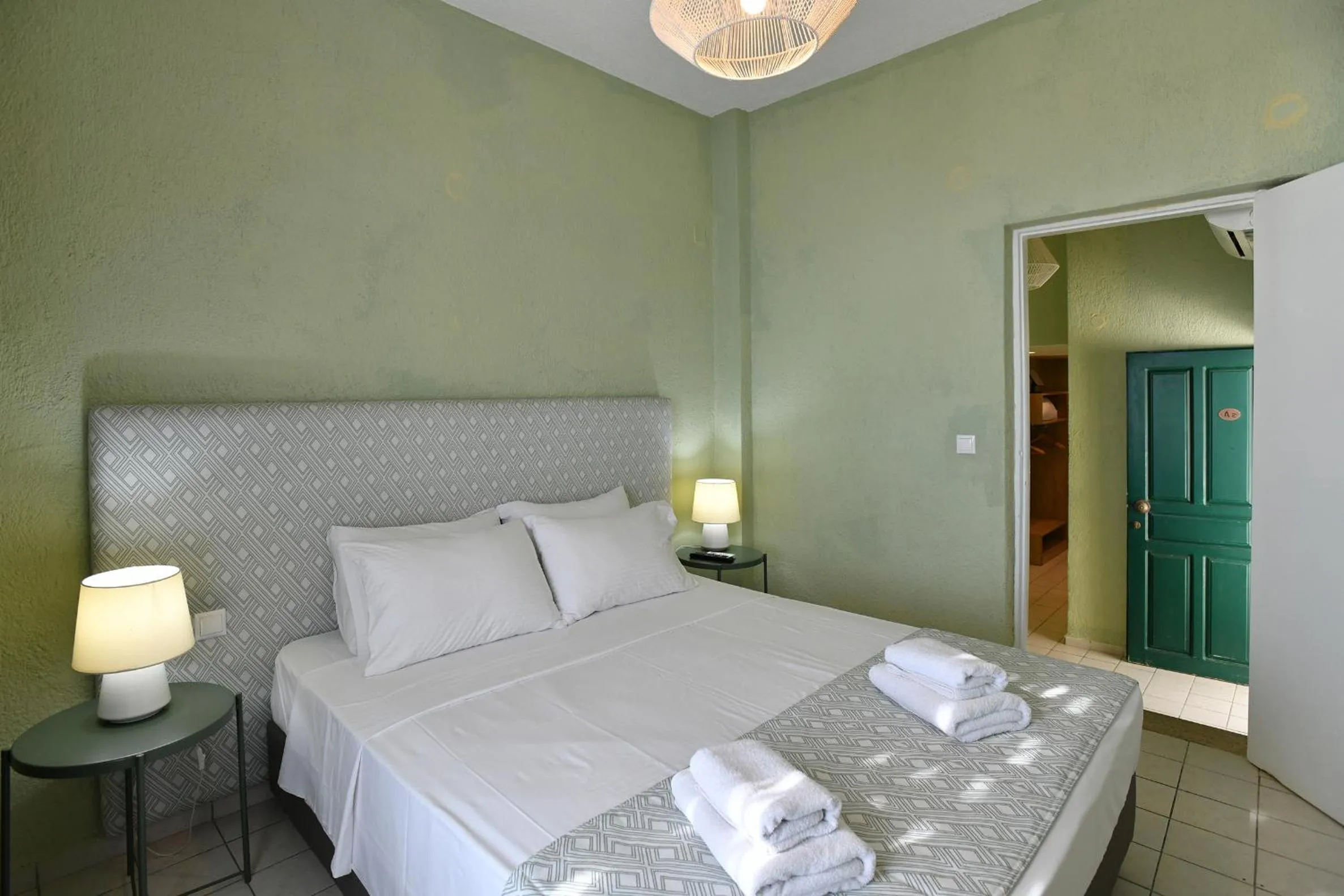 Bed in Triton Authentic Cretan Hotel