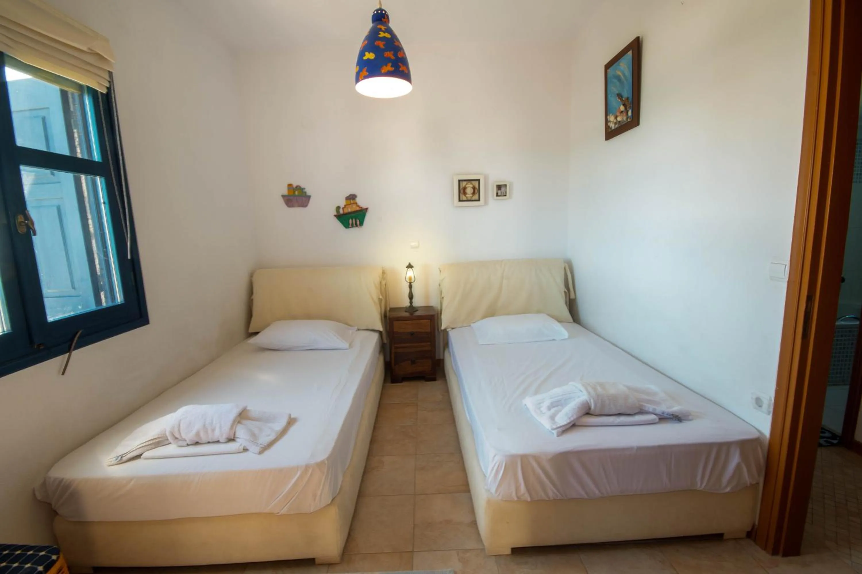 Bed in Triton Authentic Cretan Hotel