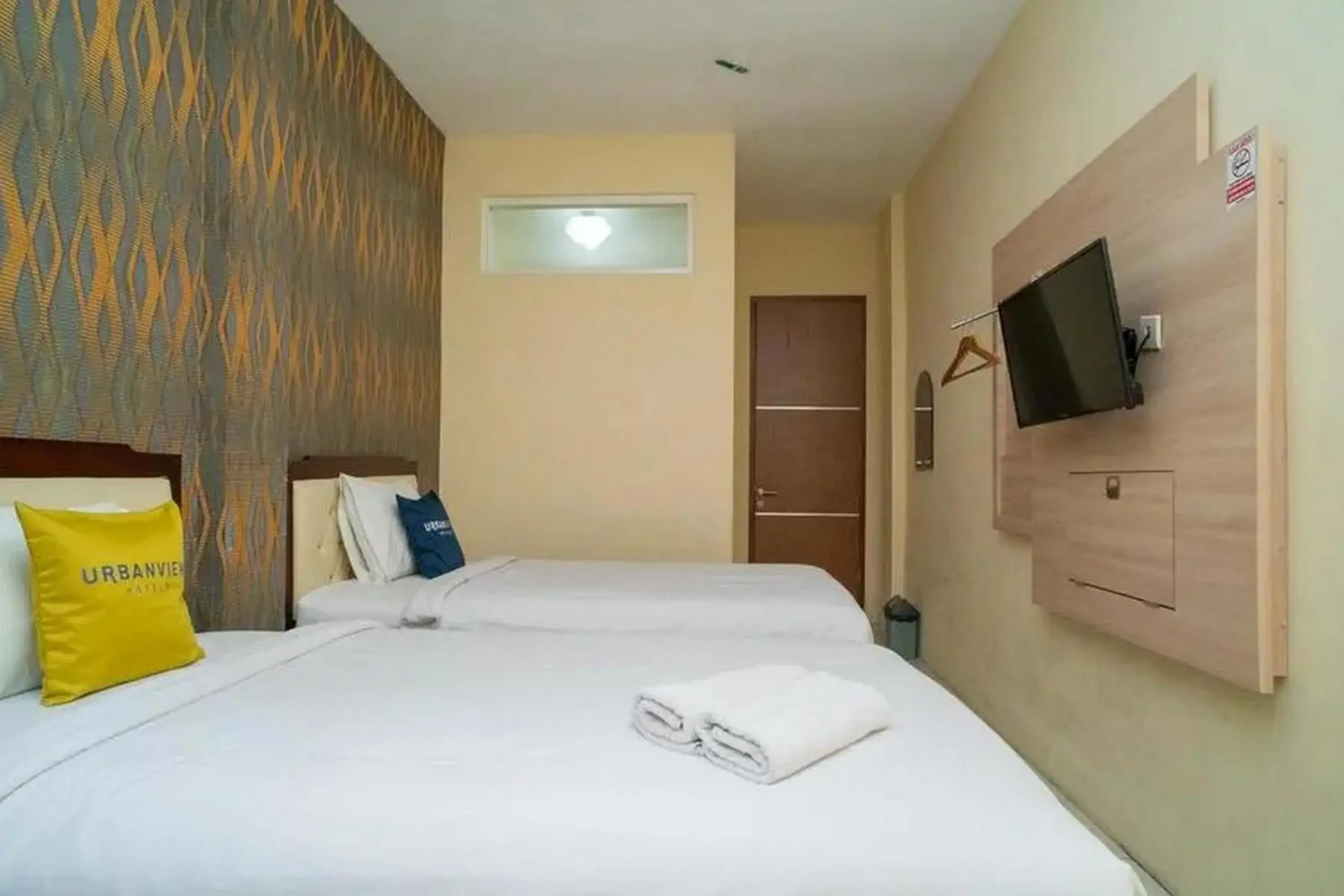 Bed in Urbanview Hotel Omah Anin Batu by RedDoorz Bed in Urbanview Hotel Omah Anin Batu by RedDoorz