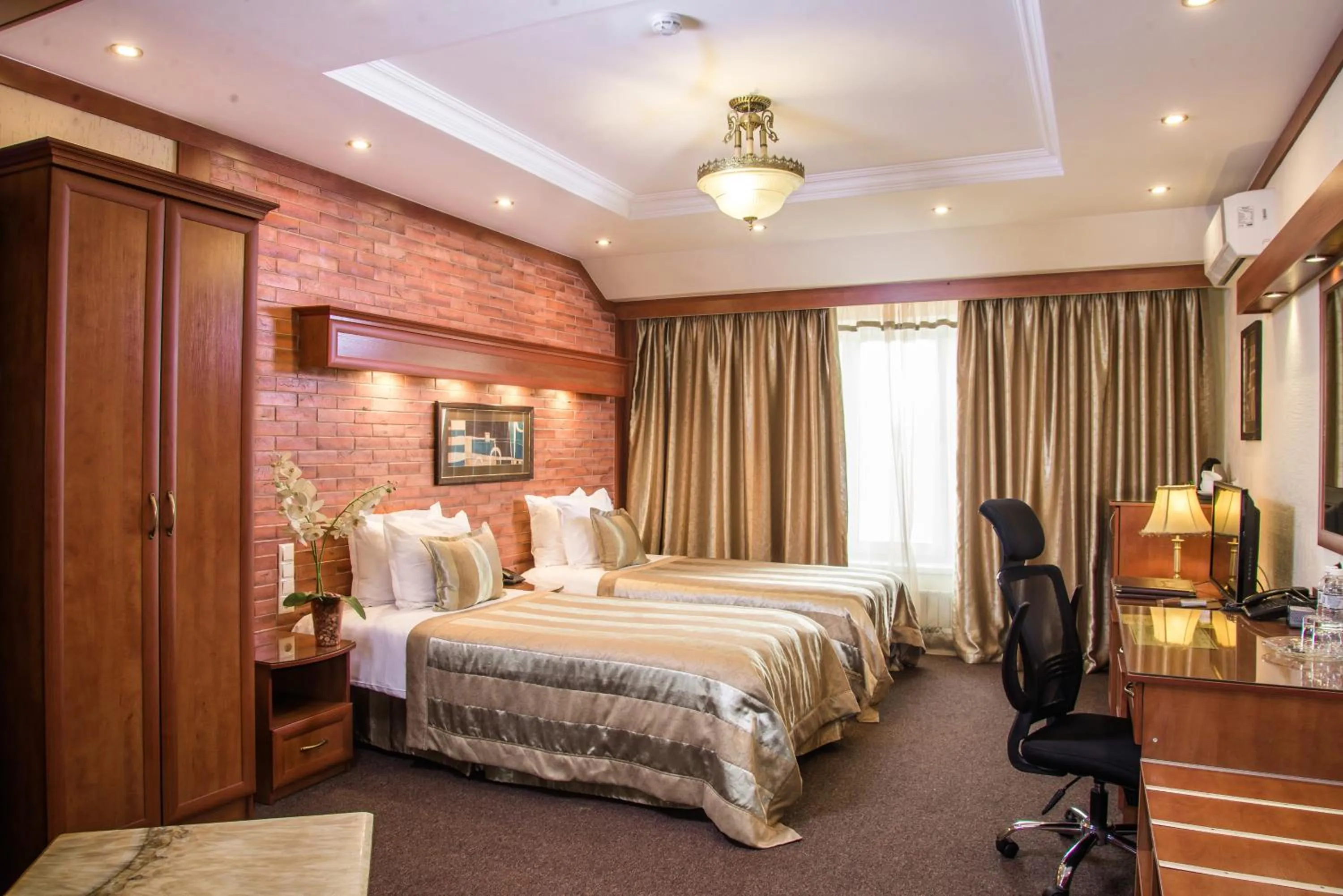 Bed in Hotel Uyut Almaty